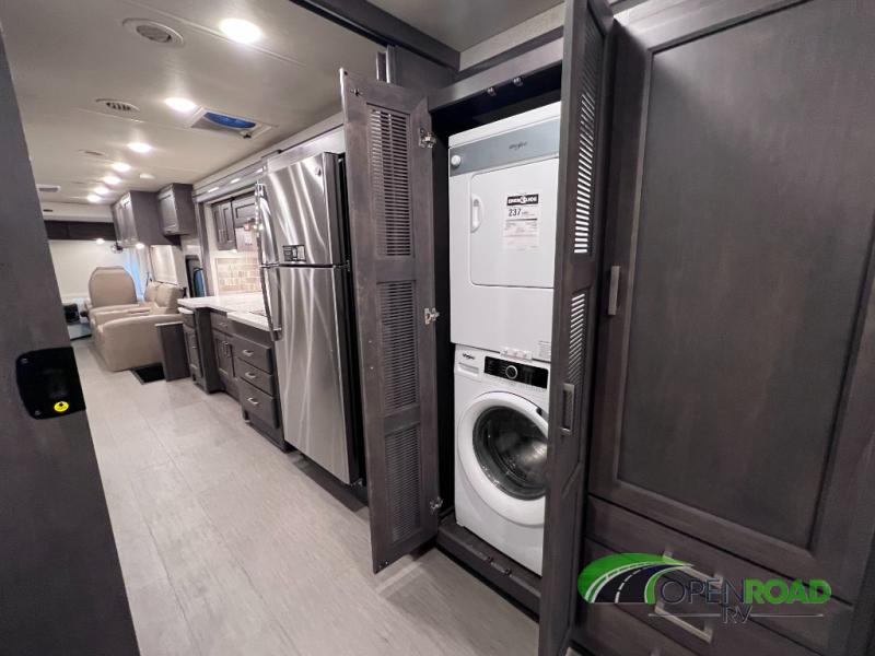 This rv rental features a full kitchen with a stainless steel fridge, plus a stackable washer/dryer unit.. Thor Palazzo 2023