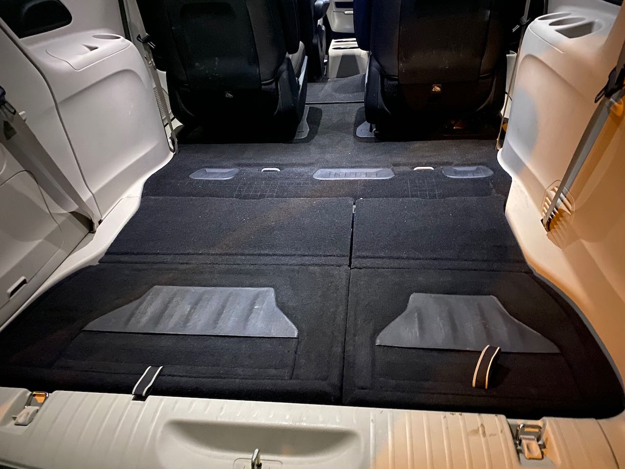 RV rental: Vehicle's flat, carpeted rear floor with seats folded for cargo or sleeping space.. Chrysler Other 2020