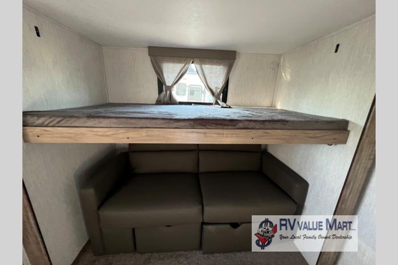 RV rental: This camper features a bunk bed over a pull-out sofa, maximizing space for comfortable travel.. Forest River Palomino Solaire 2023
