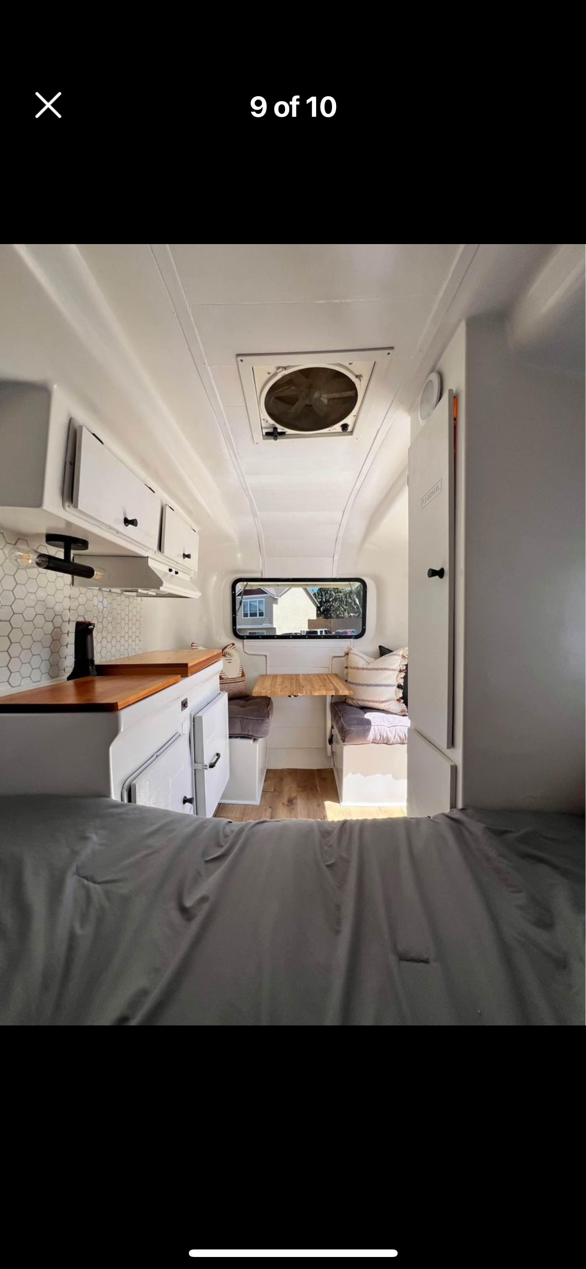 Bright RV rental interior: kitchenette, dinette, and bed in a compact camper design.. Burro Fiberglass CT13 Camper 1986