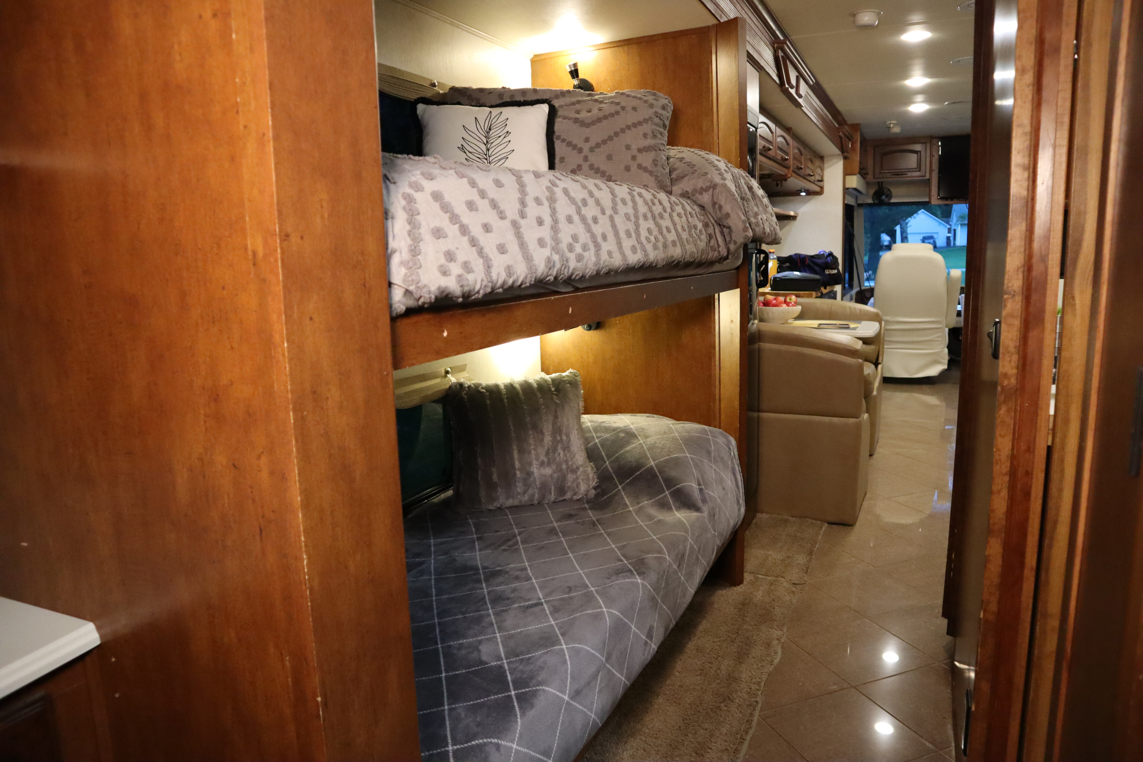 Comfortable bunk beds and a spacious interior are highlights of this RV rental, perfect for your next family adventure.. Coachmen Cross Country Sportscoach 2012