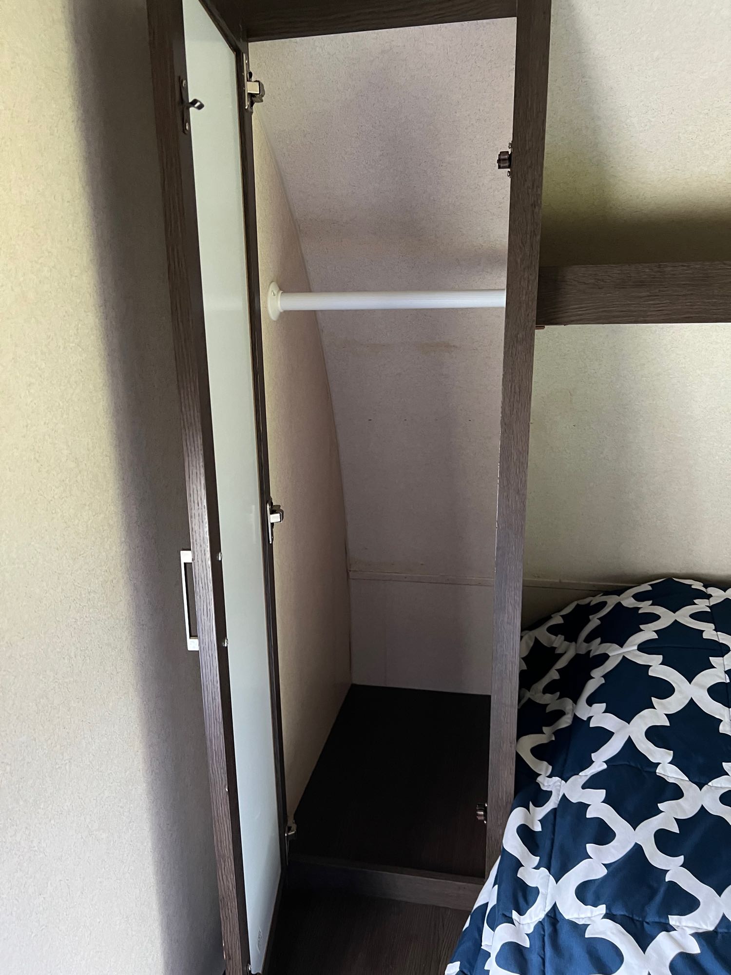 Two closets in the master bedroom for clothes, along with a shelf above the bed . Forest River Salem 2019