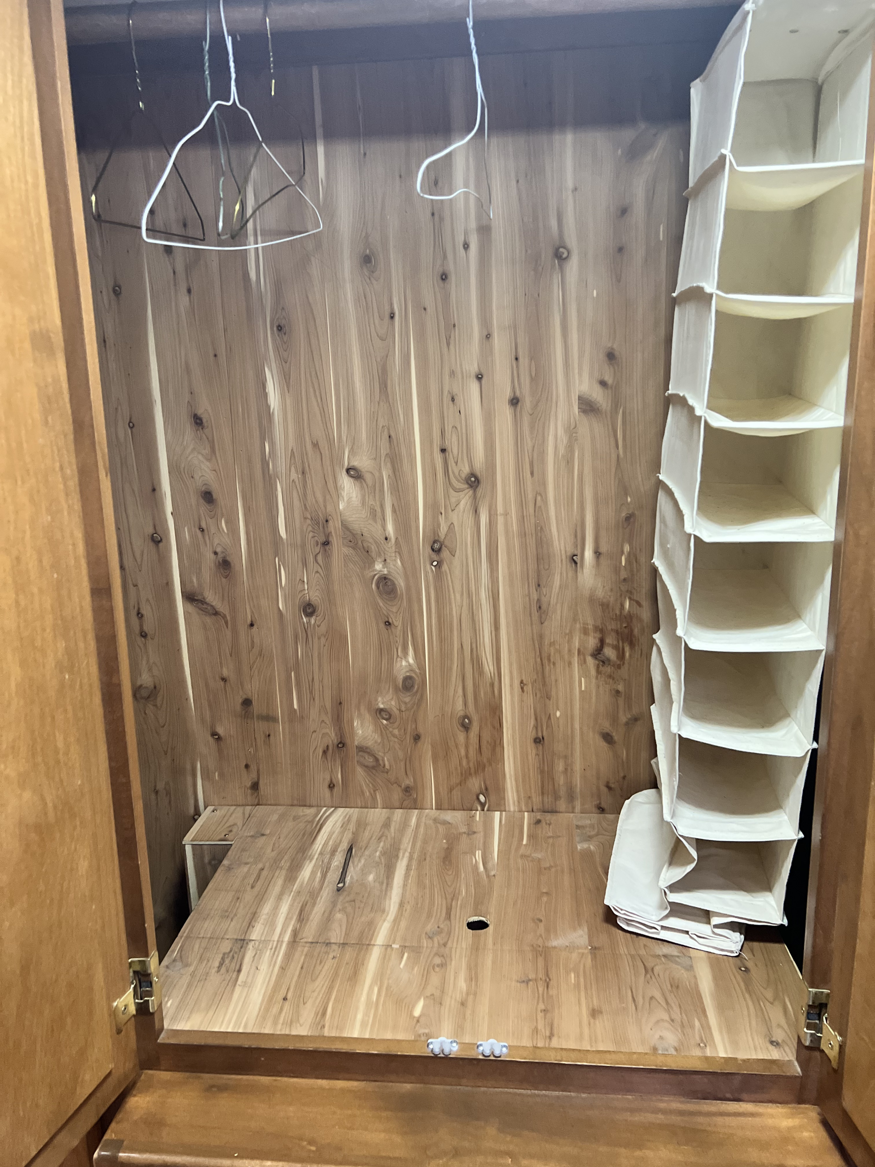 RV rental cedar closet: hangers & fabric shelf storage shown. Perfect compact wardrobe interior for your adventure.. Safari Sahara Magnum Coach 1993