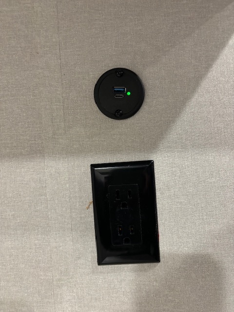 Convenient RV rental interior with USB-C, USB-A charger, and AC outlet for all your charging needs.. Forest River Aurora Aurora Light 2024