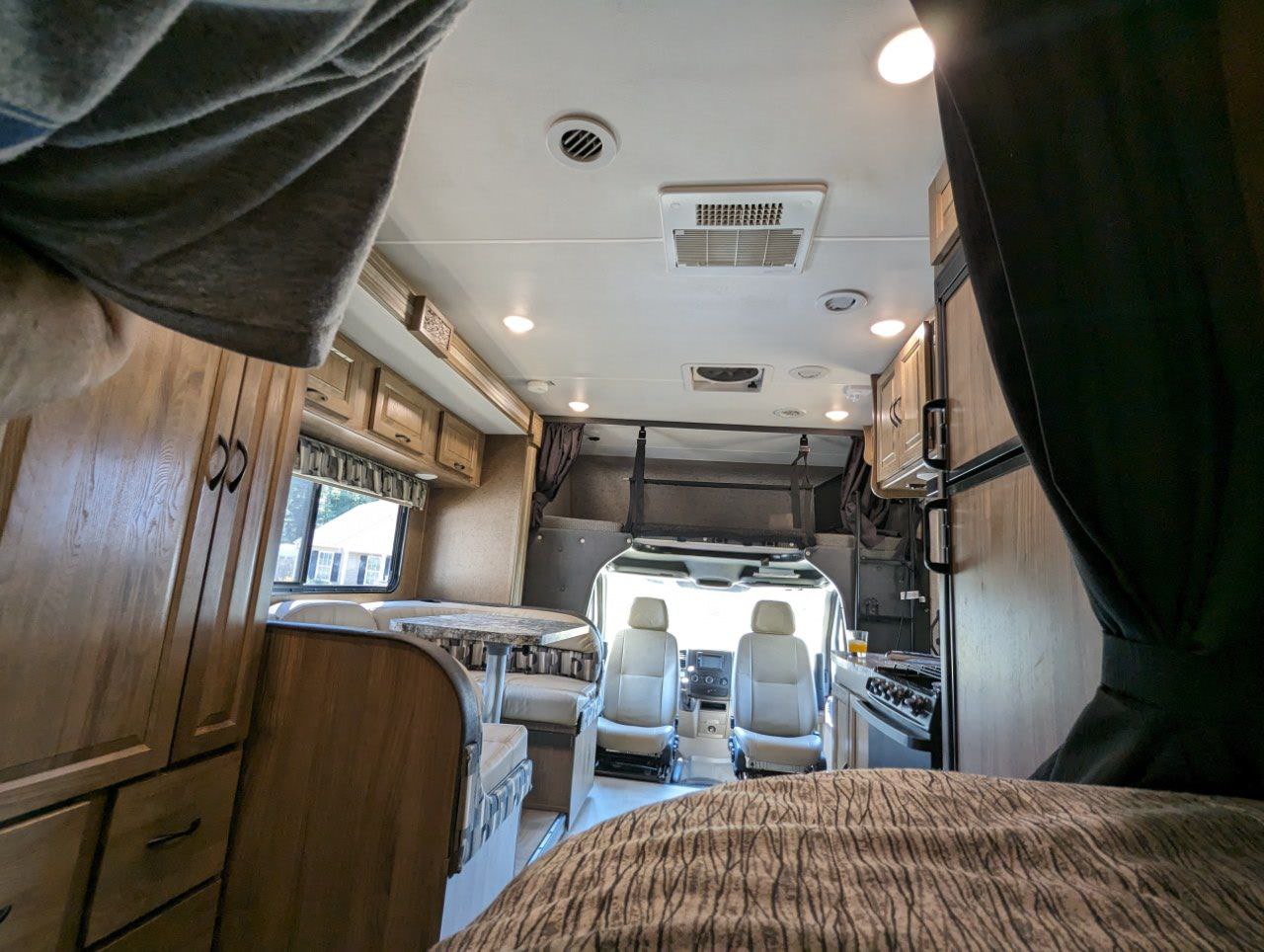 RV rental interior: A spacious view from the rear, showing the dinette, kitchen, and front cabin.. Forest River Coachmen Prism 2018