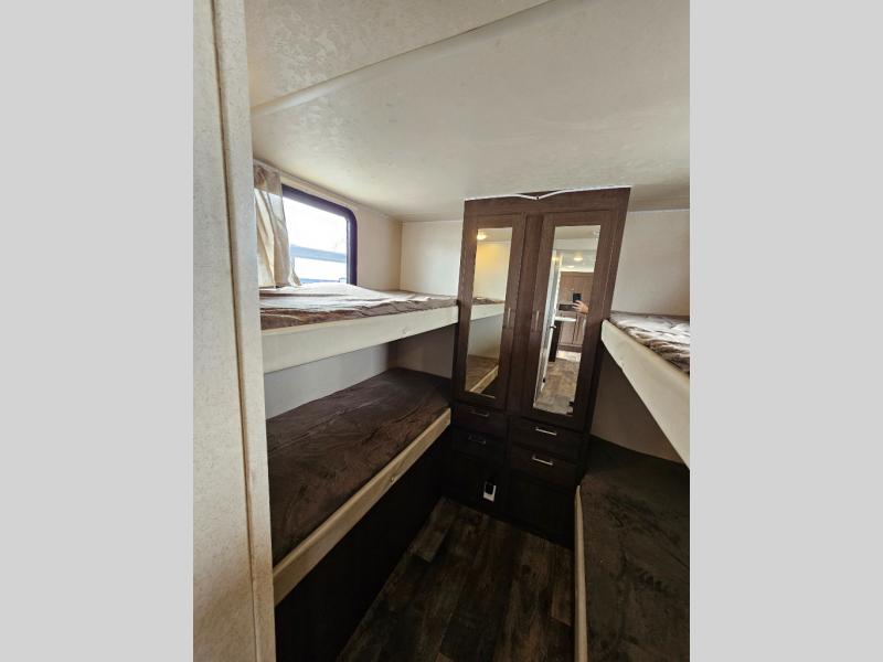 RV rental: Bunk beds and a mirrored wardrobe in a cozy camper interior, perfect for family adventures.. Forest River Salem Cruise Lite 2019