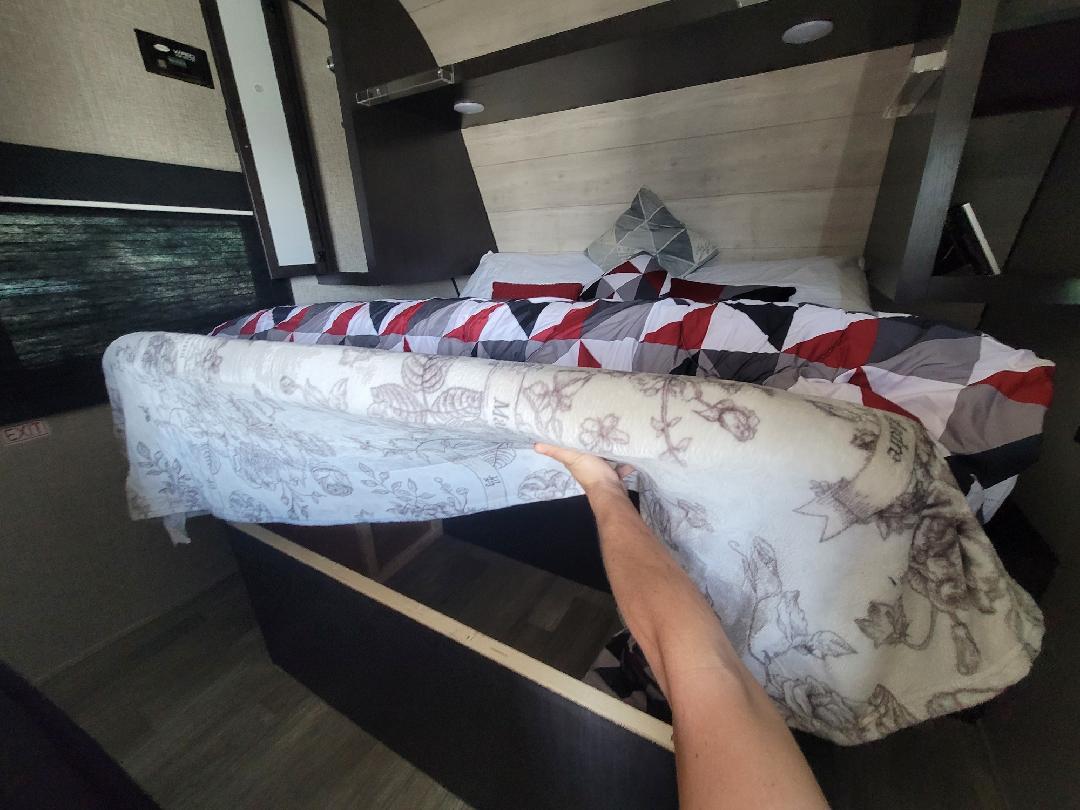 RV rental bedroom: lifting mattress reveals under-bed storage, a smart space solution for compact travel.. Jayco Jay Flight SLX 8 2022