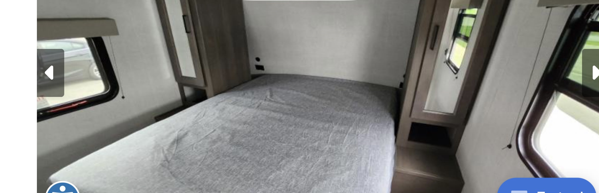 RV rental bedroom interior: features a compact bed with grey cover, storage cabinets, and windows.. Grand Design Transcend Xplor 2024