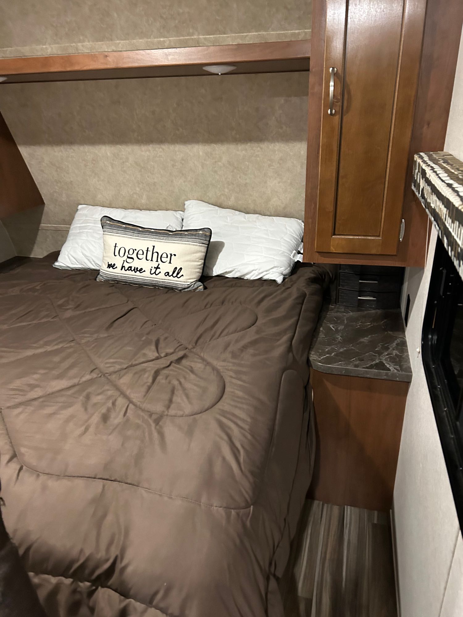 Cozy RV bedroom with a comfortable bed and built-in storage. Perfect for your next rv rental adventure.. Jayco Jay Flight SLX 2017