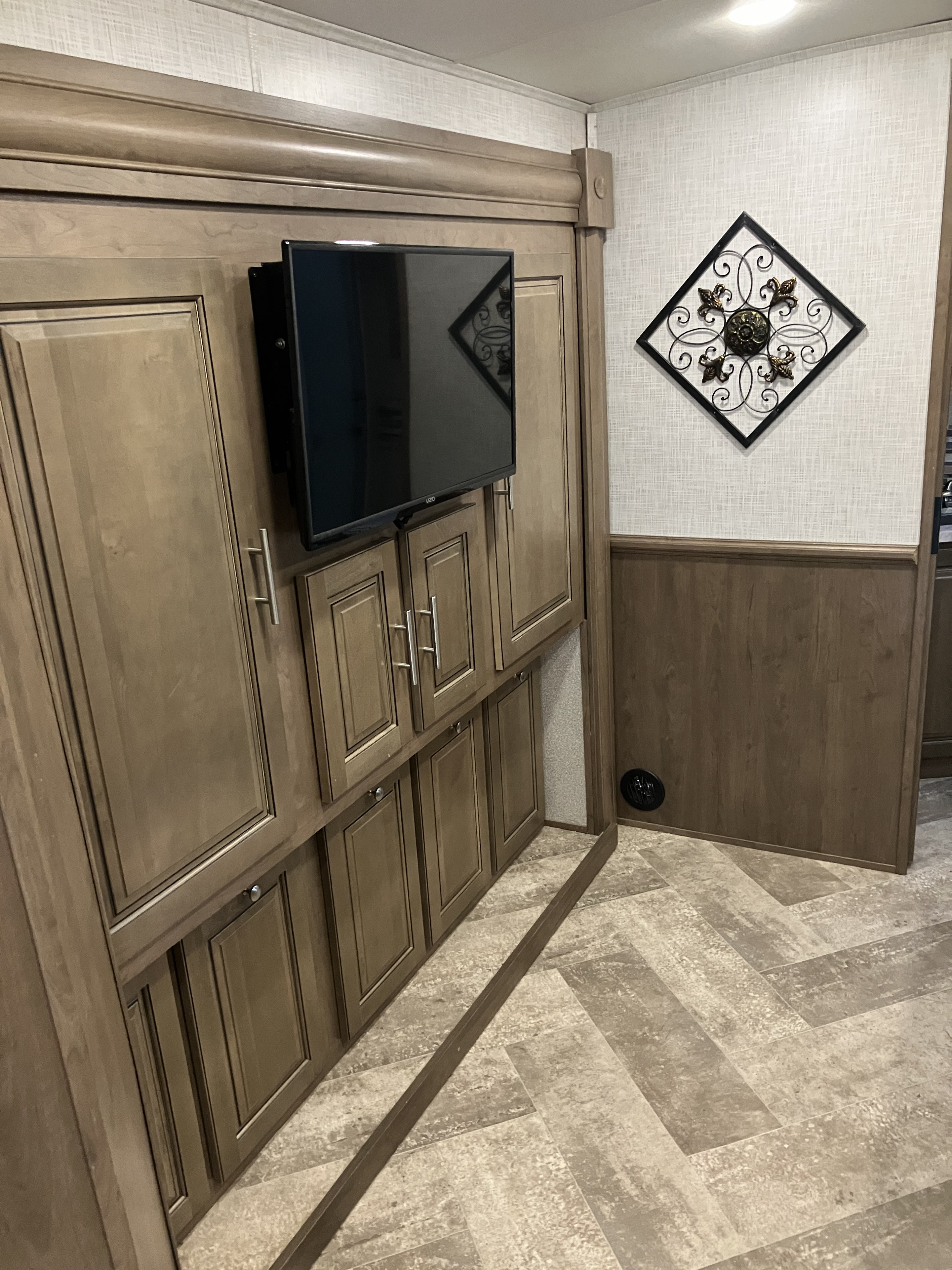 Explore this RV rental's modern interior featuring a mounted TV, extensive storage cabinets, and stylish decor.. Forest River GEORGETOWN GT5 2019