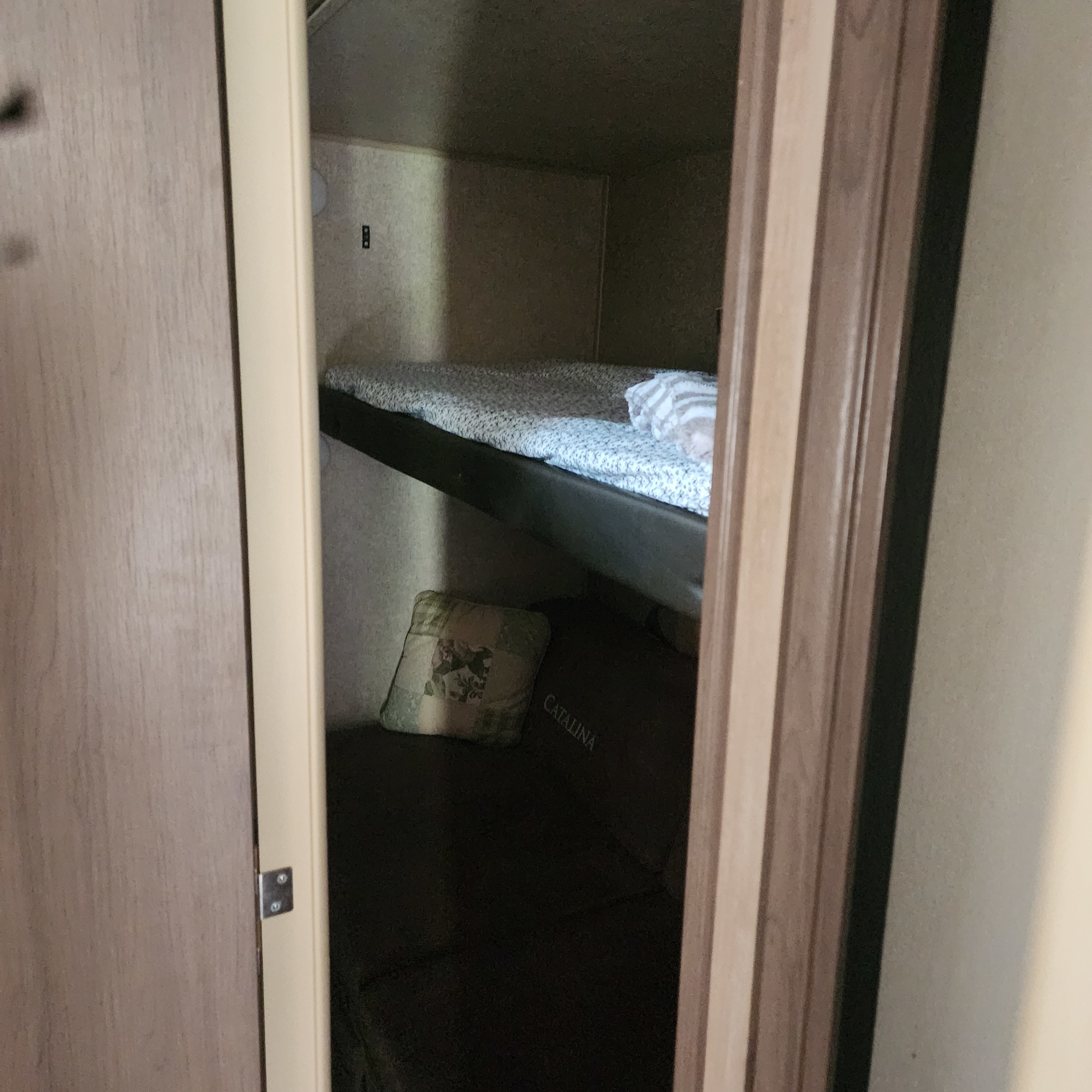 Inside an RV rental: cozy bunk beds, including a lower CATALINA sleeper, ready for adventures.. Forest River Coachmen Catalina Legacy 2019