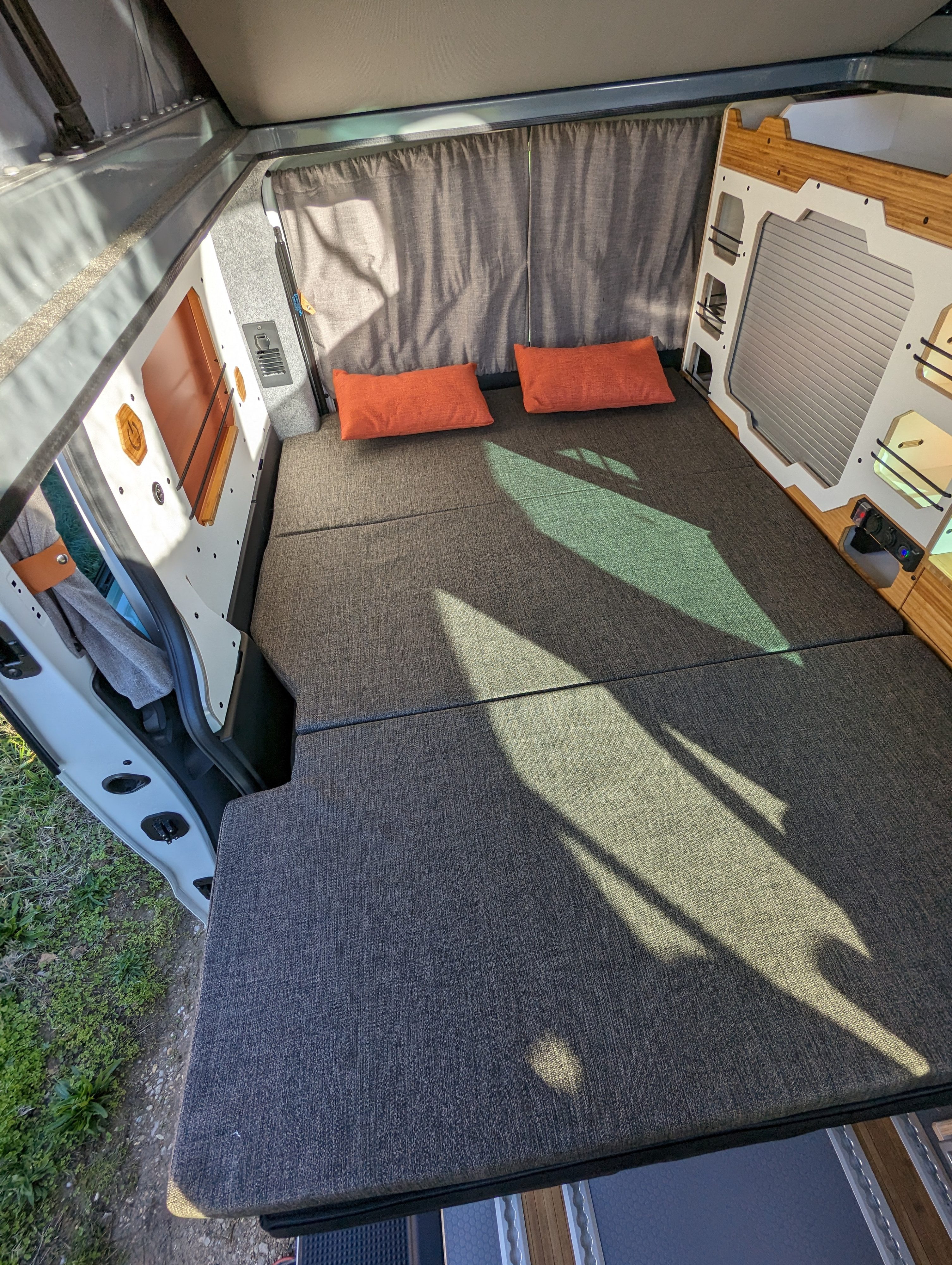 Explore mobile living! This RV rental offers a cozy, customized bed/lounge area with natural light and smart storage.. Renault TRAFIC 2024