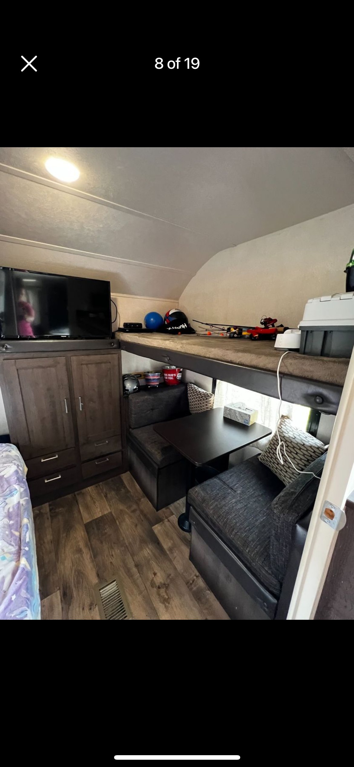 RV rental interior: bunk beds, dinette, TV, & wooden floor in this travel trailer. Perfect for getaways.. Forest River Salem 2018