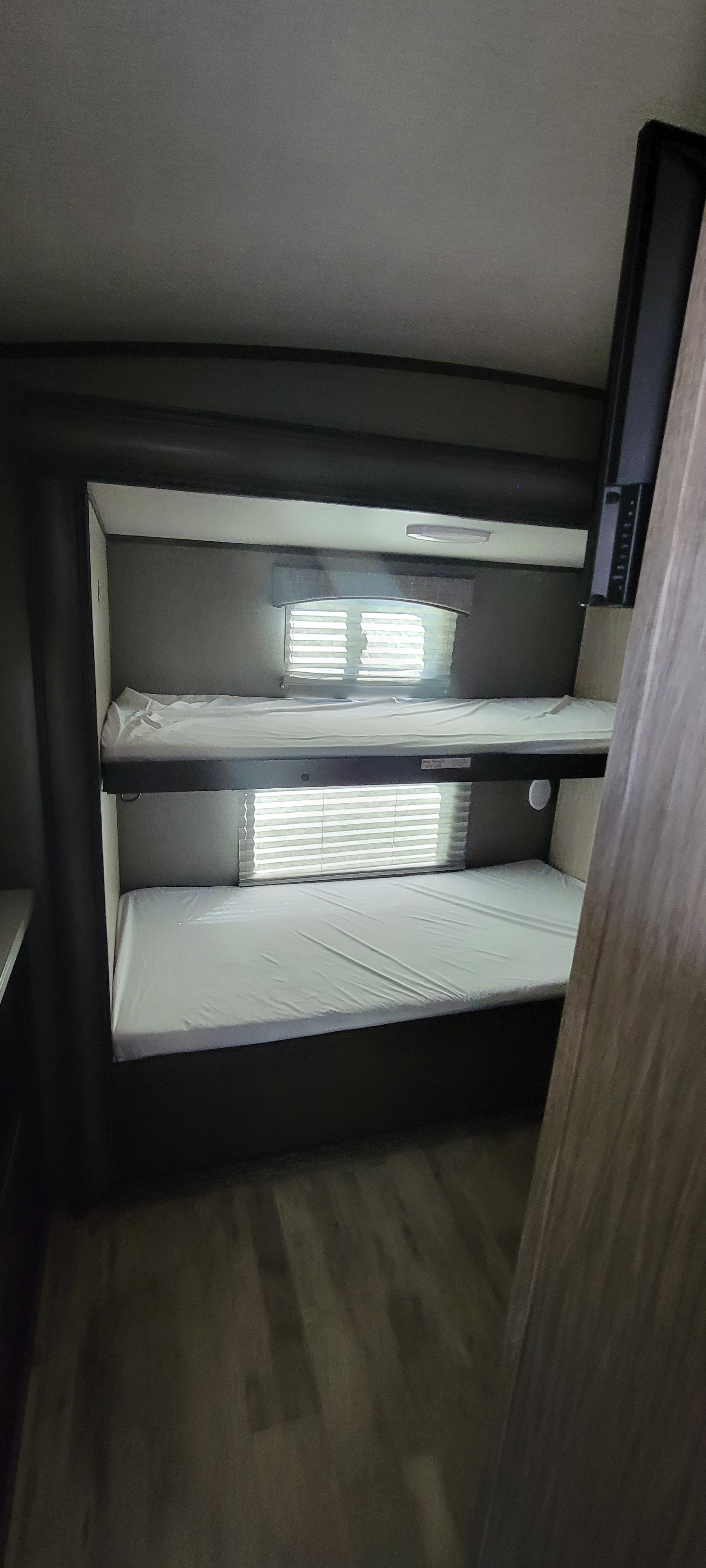 RV rental: Interior view of comfortable bunk beds, complete with clean mattresses and privacy blinds.. Heartland Sundance 2019