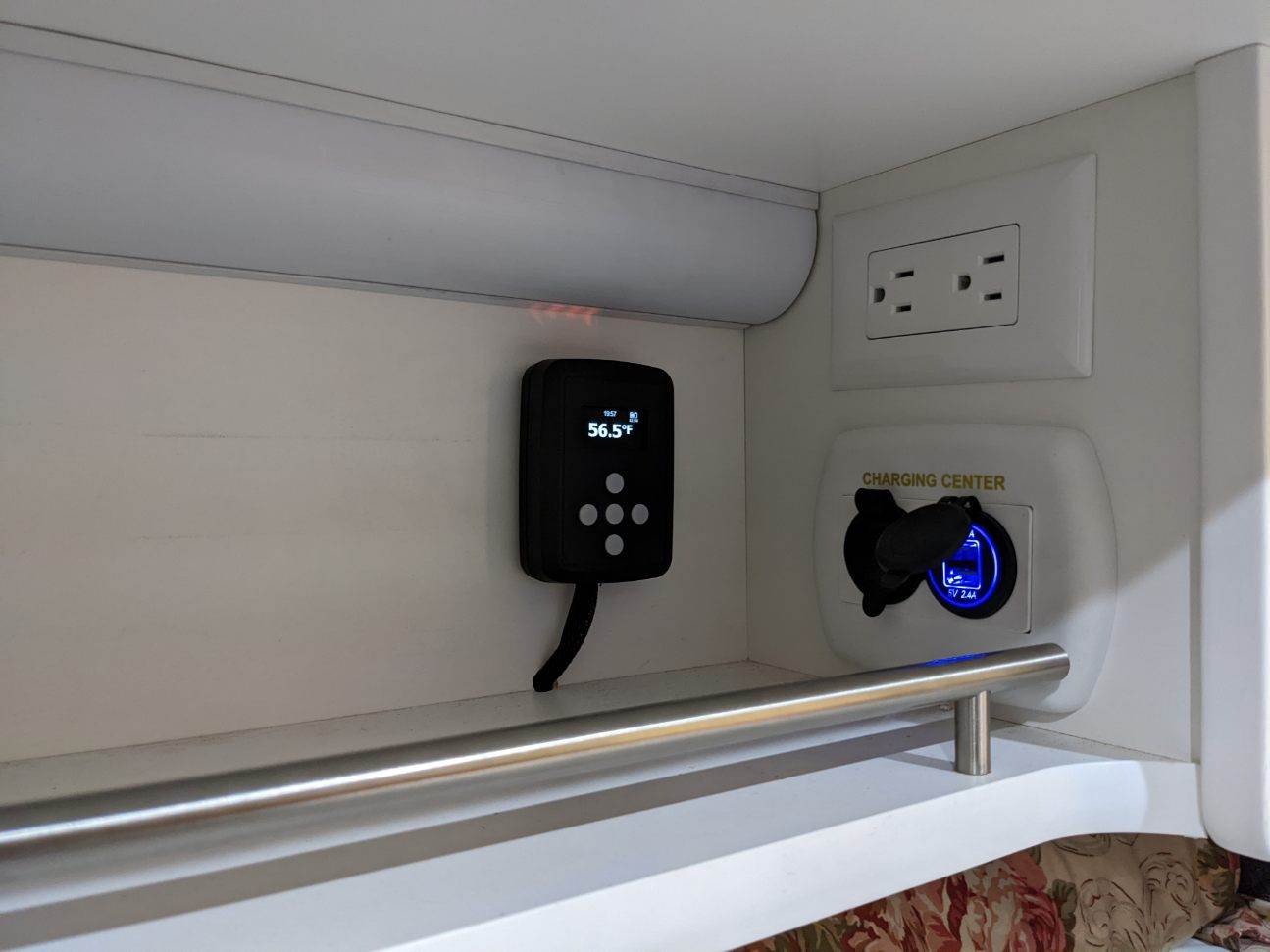 RV rental: digital controller showing 56.5°F, AC power outlet, and a glowing USB charging center for convenience.. Little Guy Little Guy Trailer 2018