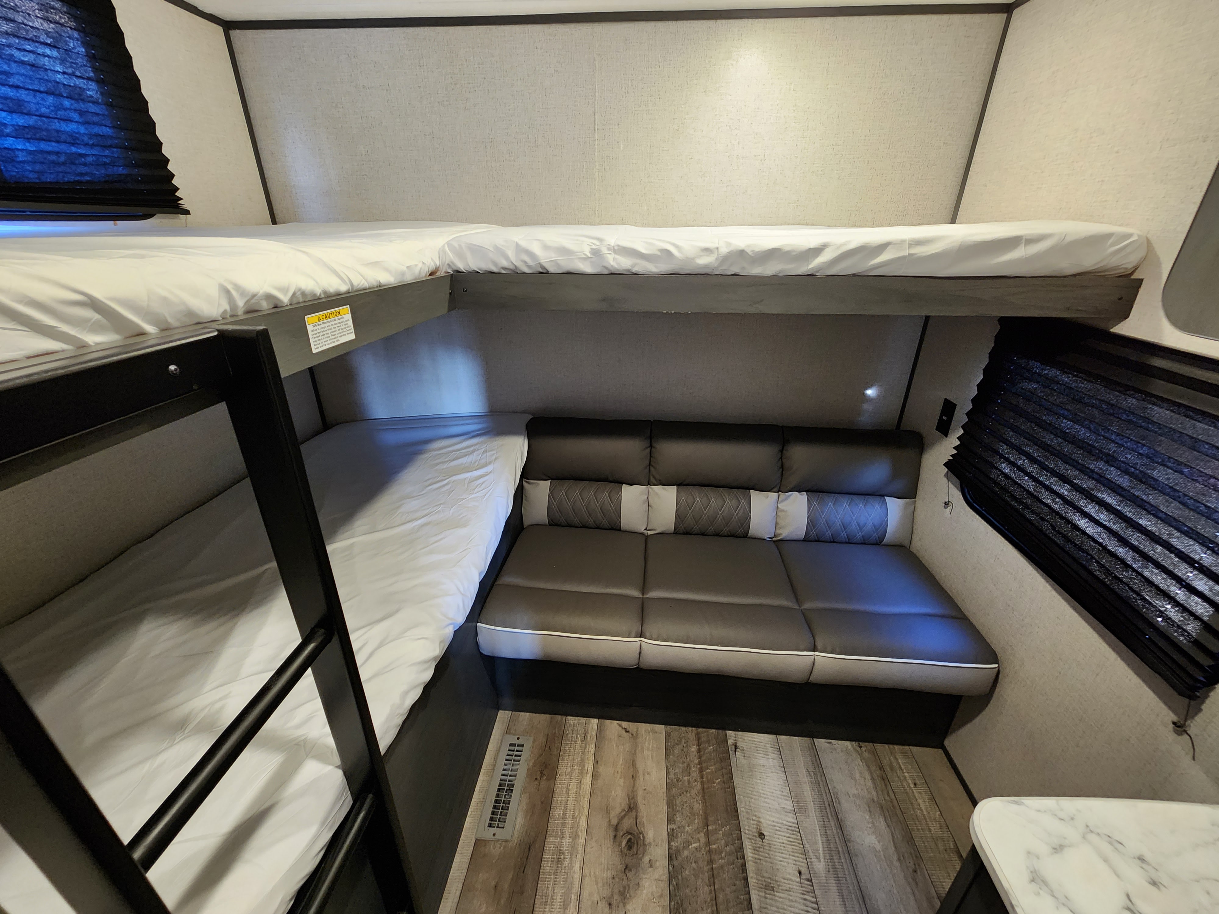 RV rental: Bright, functional interior showcasing versatile bunk beds (lower converts to sofa) & a cozy living area.. Dutchmen Colorado 2022