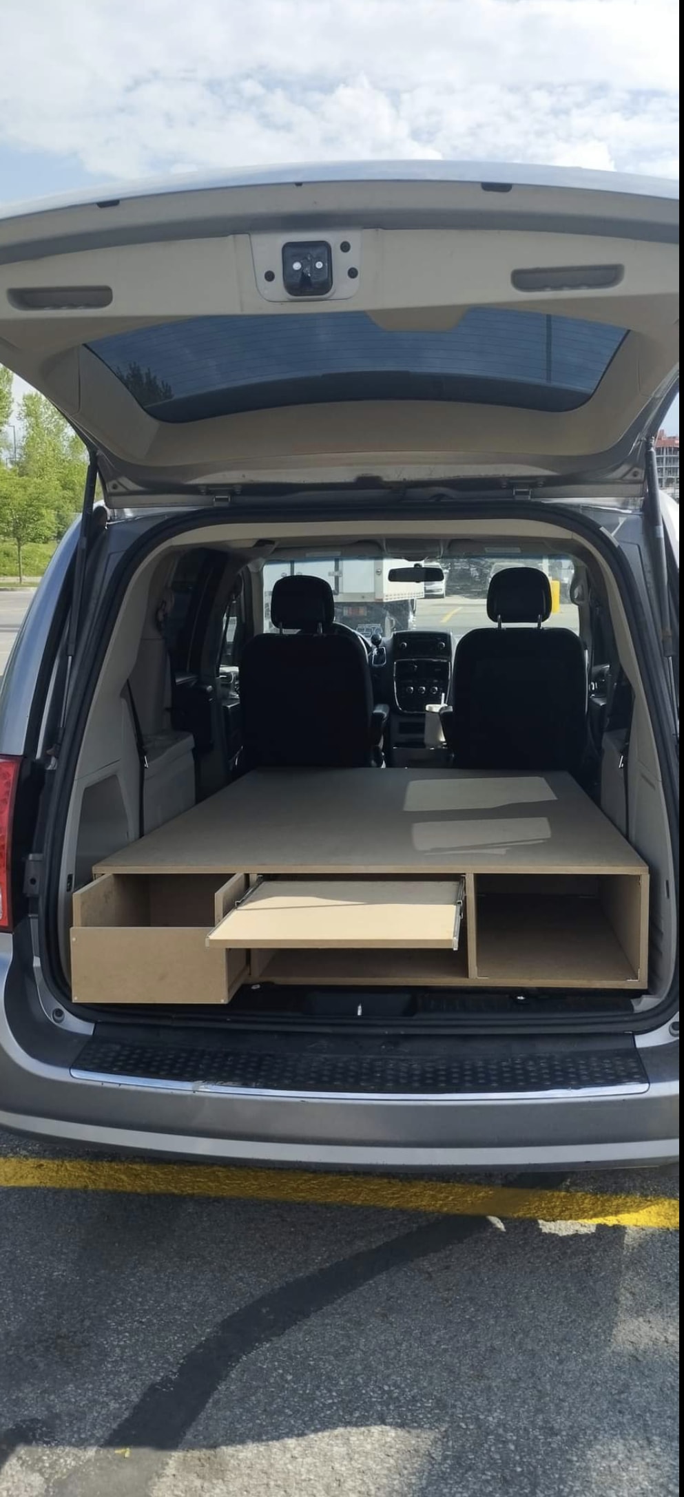 DIY minivan campervan build with pull-out bed/storage, a great RV rental alternative.. Dodge Grand Caravan 2014