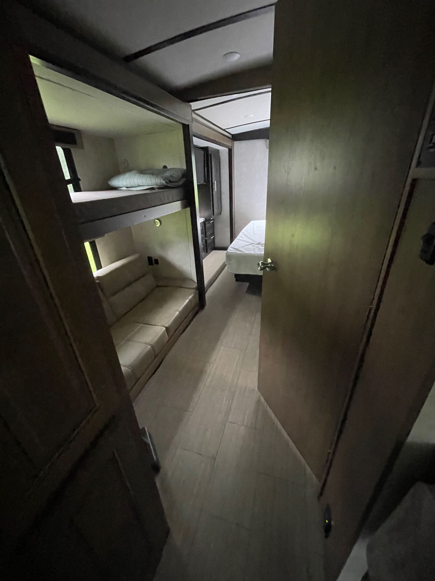 RV rental interior: Bunk beds with sofa seating, hallway leading to a private bedroom with a bed.. FR3 FR3 Motorhome 2020