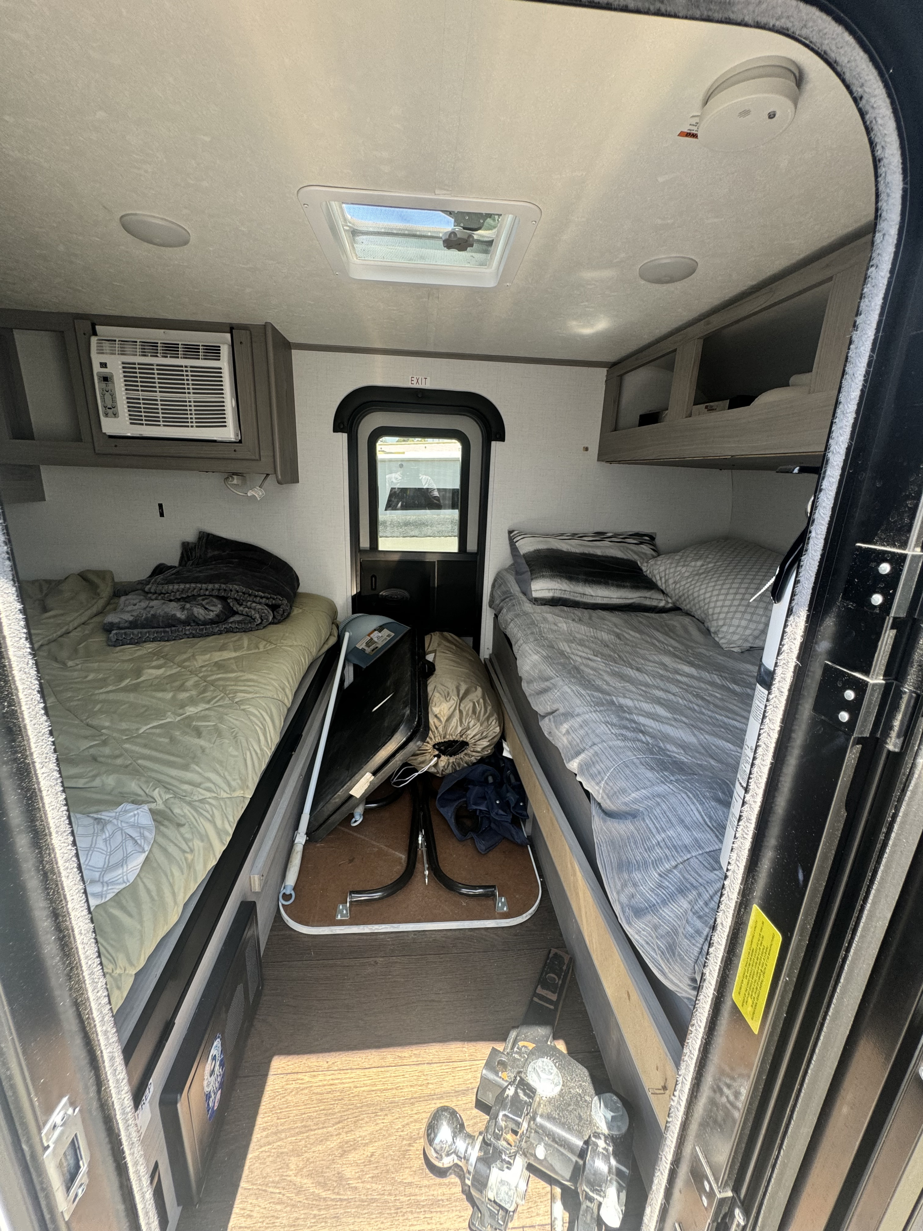 Cozy RV rental interior featuring twin beds, AC, skylight, and overhead storage, designed for compact travel.. Rubicon 4YDTCHME10RJ933964 2024