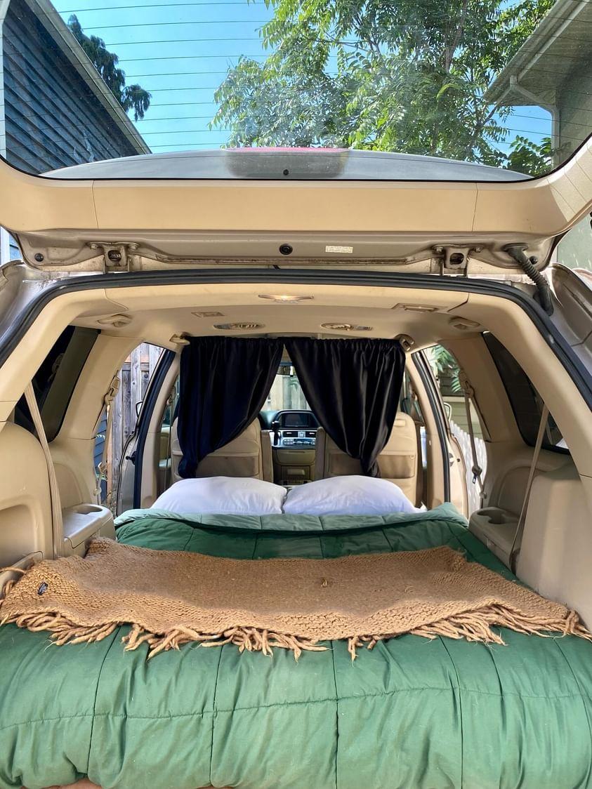 Cozy car camping SUV setup with a bed & curtains. Ideal for your next RV rental adventure or road trip.. Odyssey Honda 2007