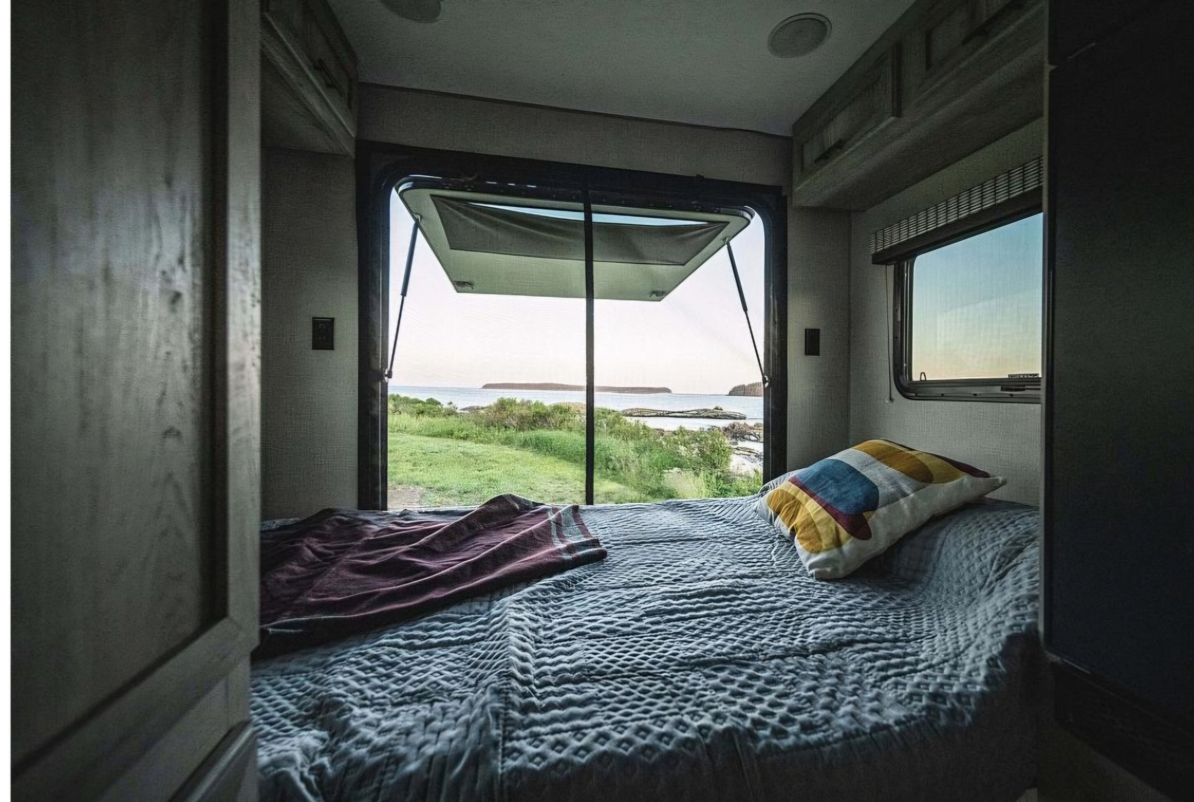 Enjoy stunning views from your cozy RV rental bedroom. Perfect for your next road trip adventure and coastal travel.. KZ Escape Hatch 2022