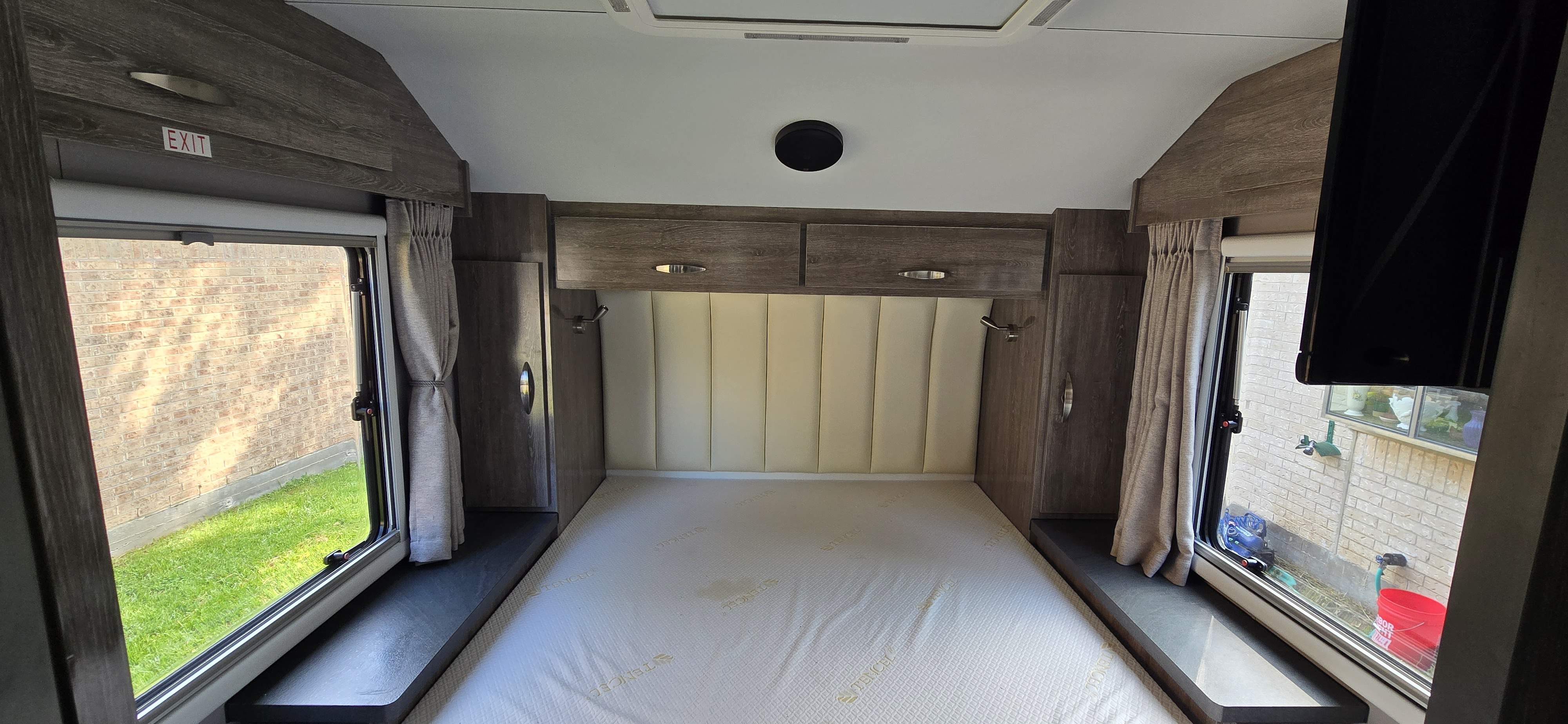 Queen-size bed with plenty of storage around. Night lights, TV, curtains, blackout shades, or insect mesh shade.. Black Series Black Series Trailer 2021
