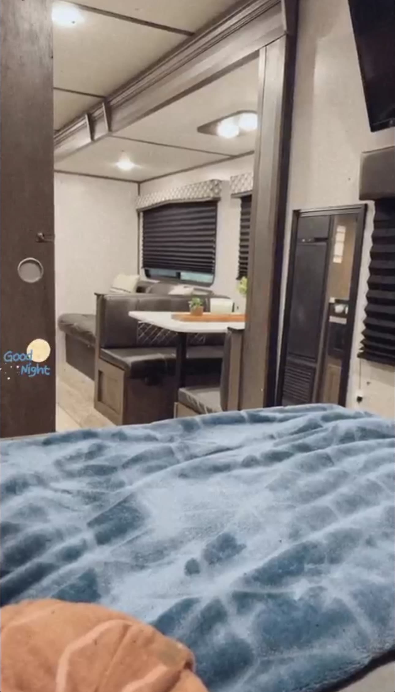 View from the bed inside an RV rental, showing the cozy dinette and living area. Ideal for compact travel.. COLEMAN Lantern 285BH 2020