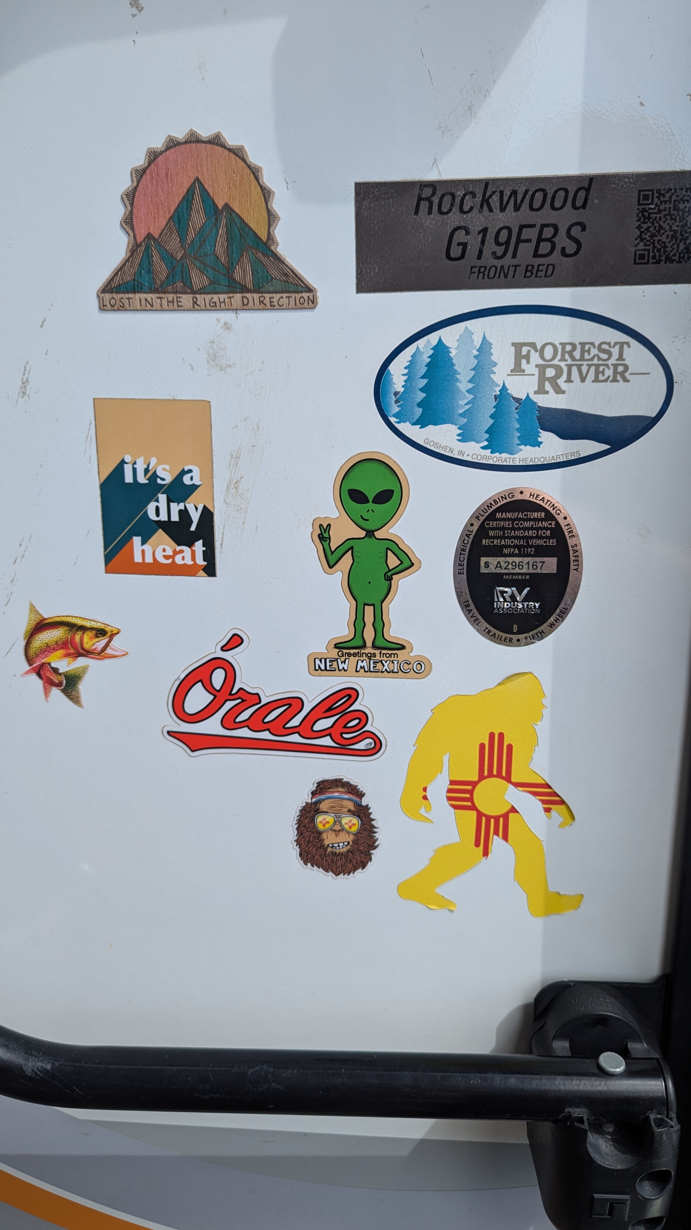 Eclectic stickers on an RV rental, from New Mexico Bigfoot to desert heat, personalizing this travel vehicle.. Forest River Rockwood Geo Pro 2022