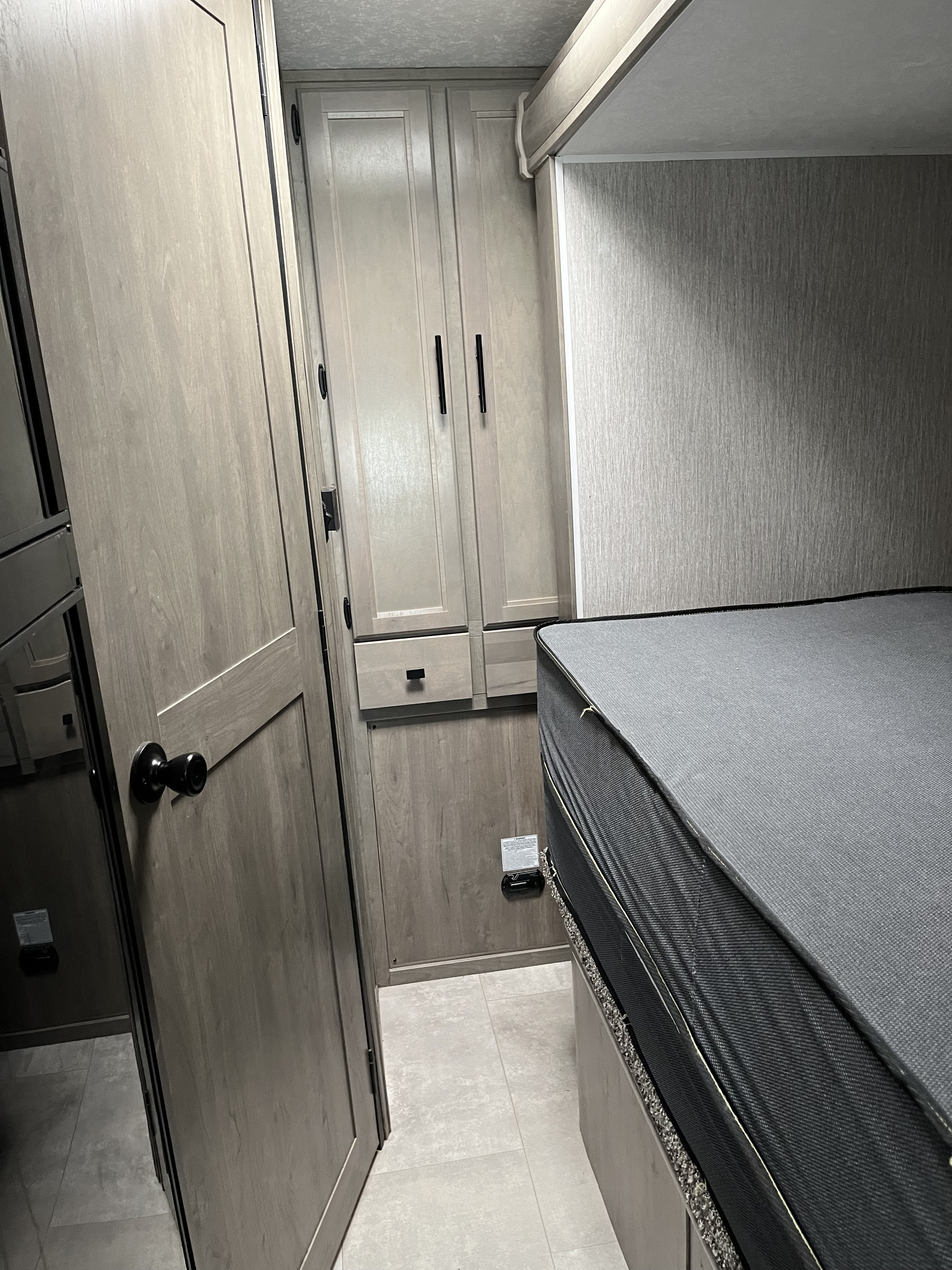 RV rental: Modern interior featuring built-in cabinets and a comfortable sleeping area.. Coachman Prism 24FS 2021