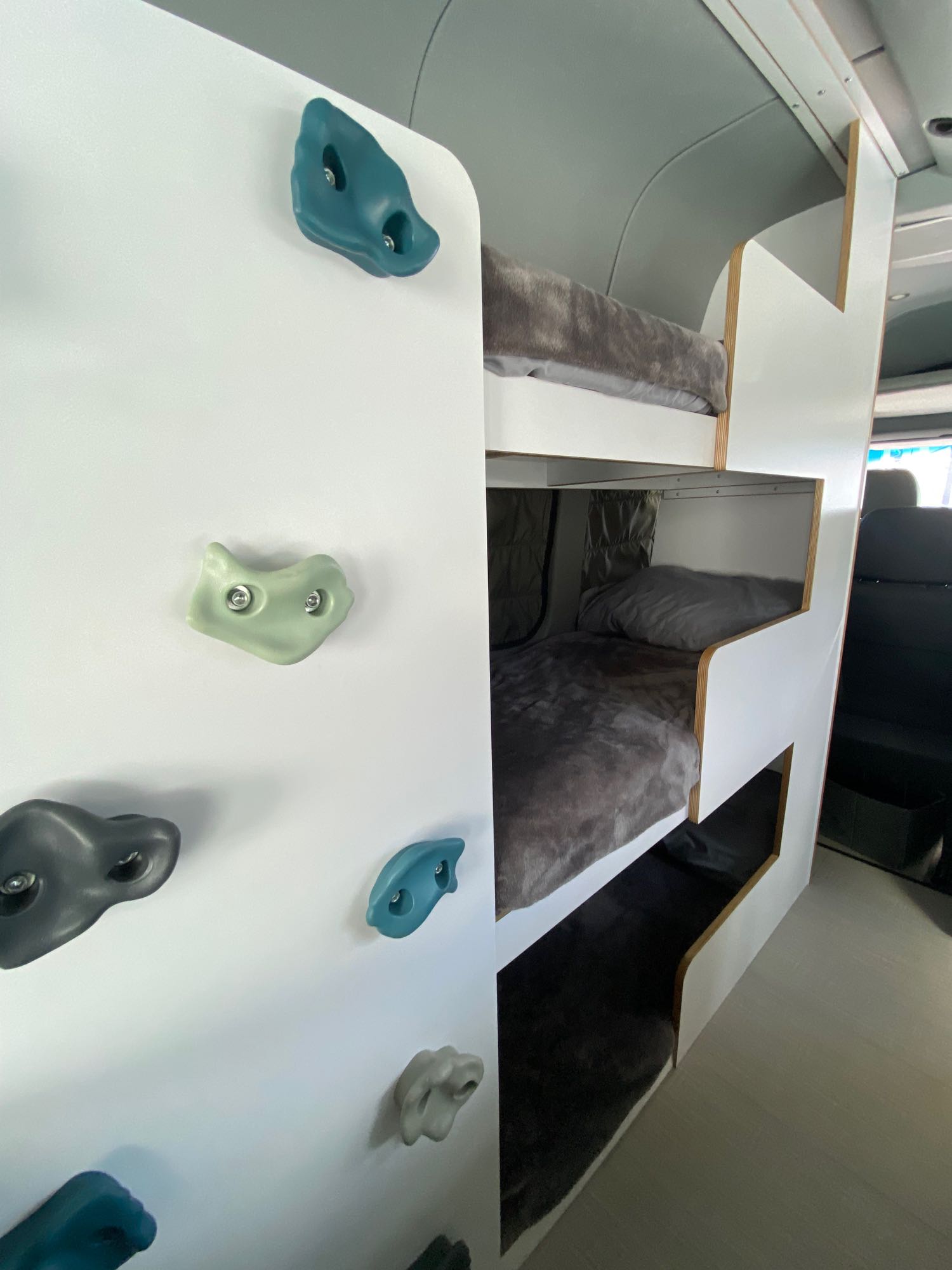 This rv rental features fun bunk beds with cozy blankets & a colorful indoor climbing wall.. Mercedes-Benz Sprinter 2014