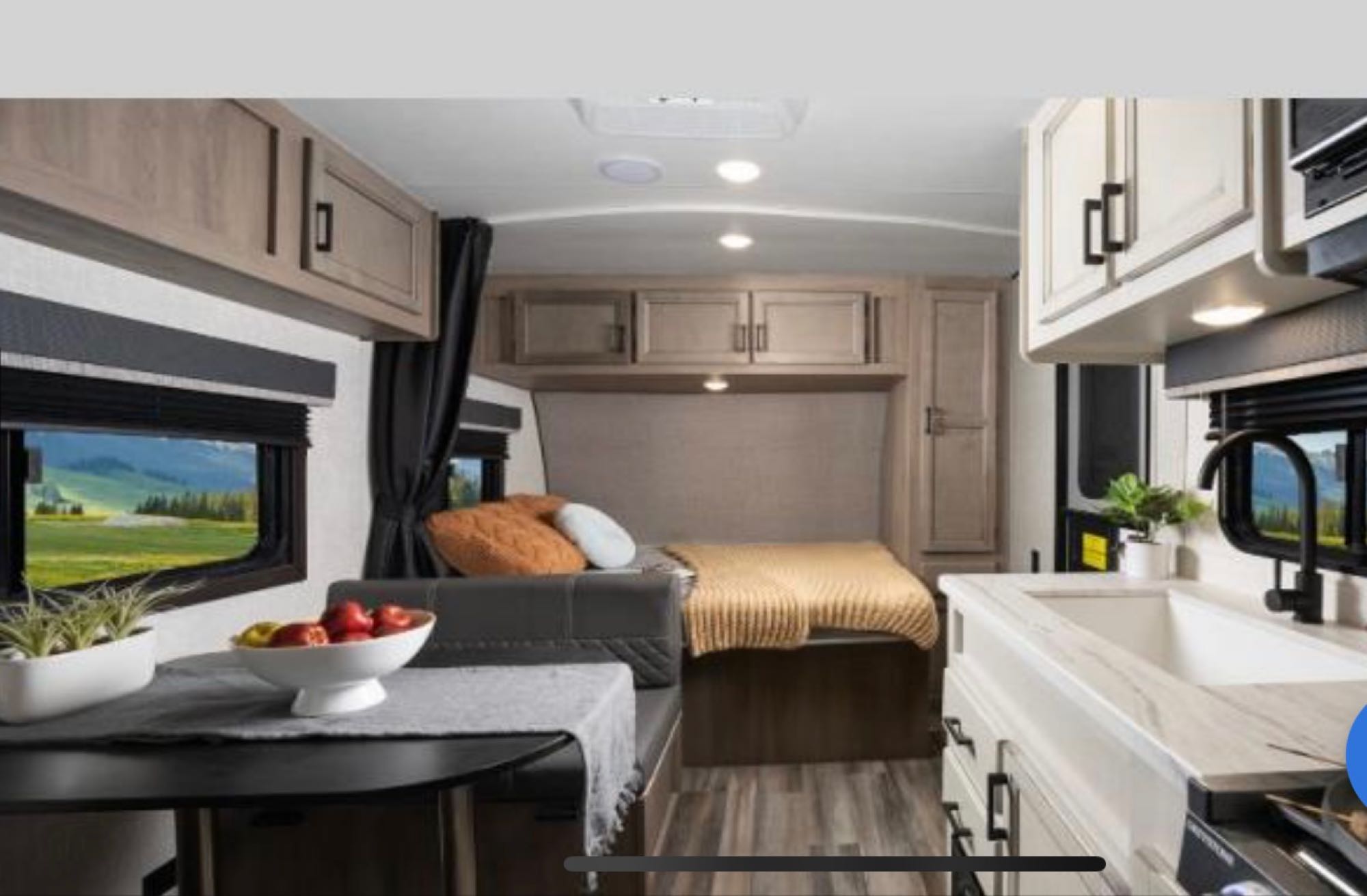 RV rental interior: a bright space with modern kitchen, dining area, and bed. Perfect for your next adventure with scenic views.. Wayfinder GoPlay 19bh 2023