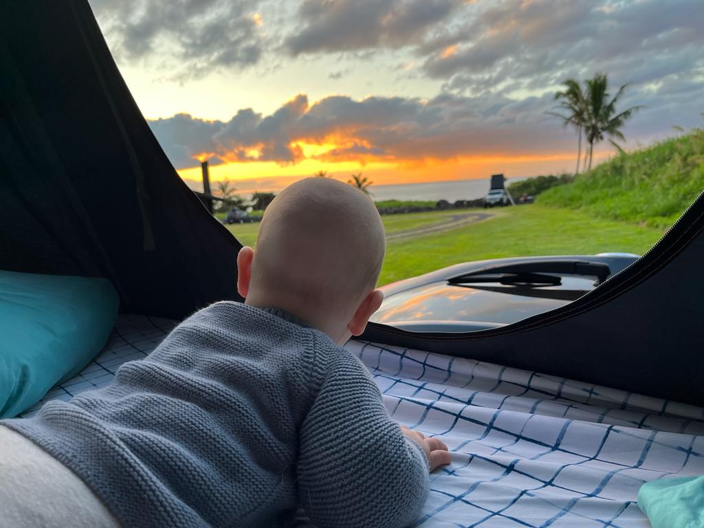 Baby watches vibrant sunset over the ocean from our cozy rv rental tent. Perfect family travel & camping.. Other Ford Transit 250 2015