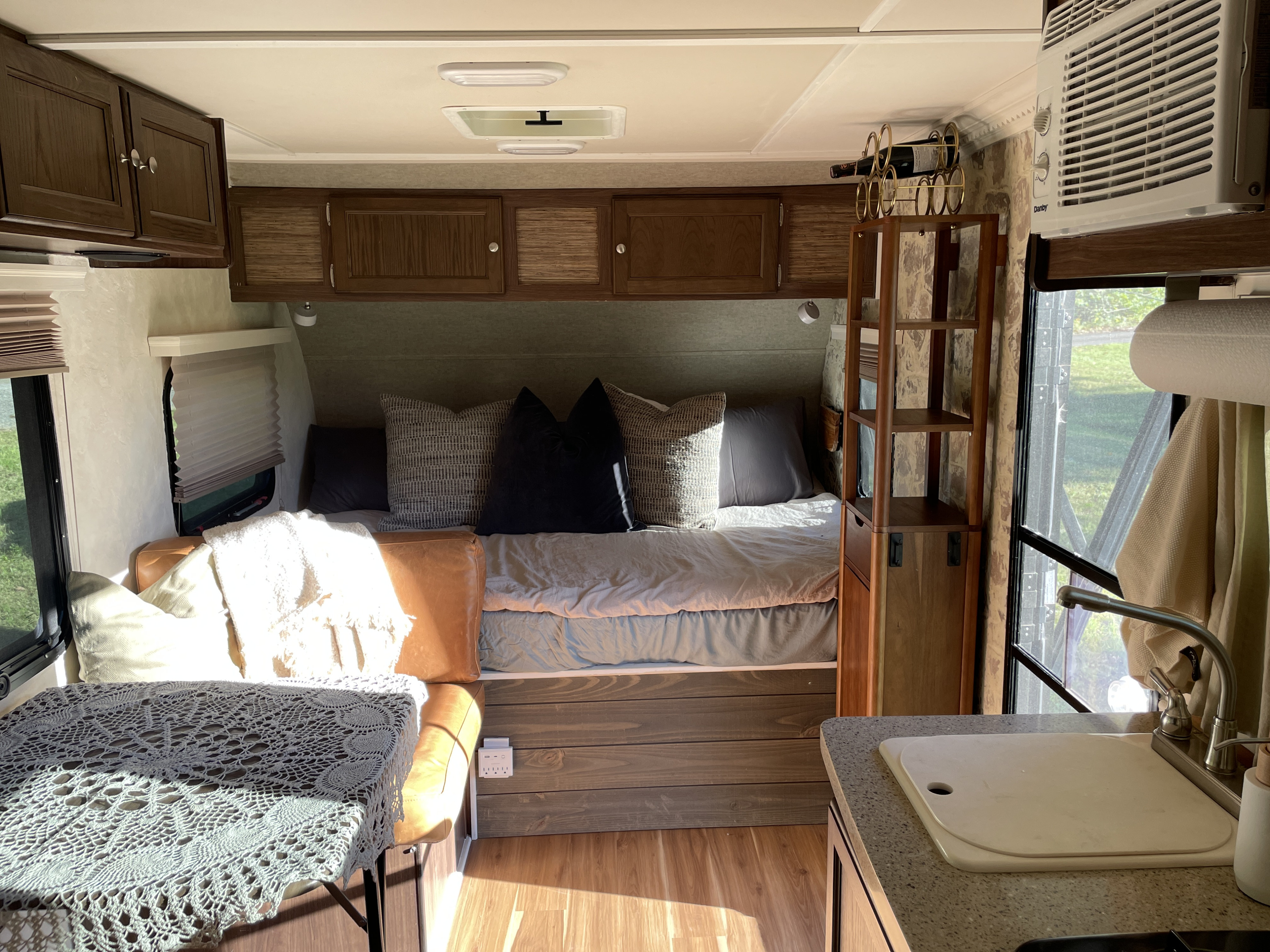 Cozy RV rental interior with a comfortable bed, kitchenette, and dinette, great for travel.. Forest River Palomino Palomini 2017