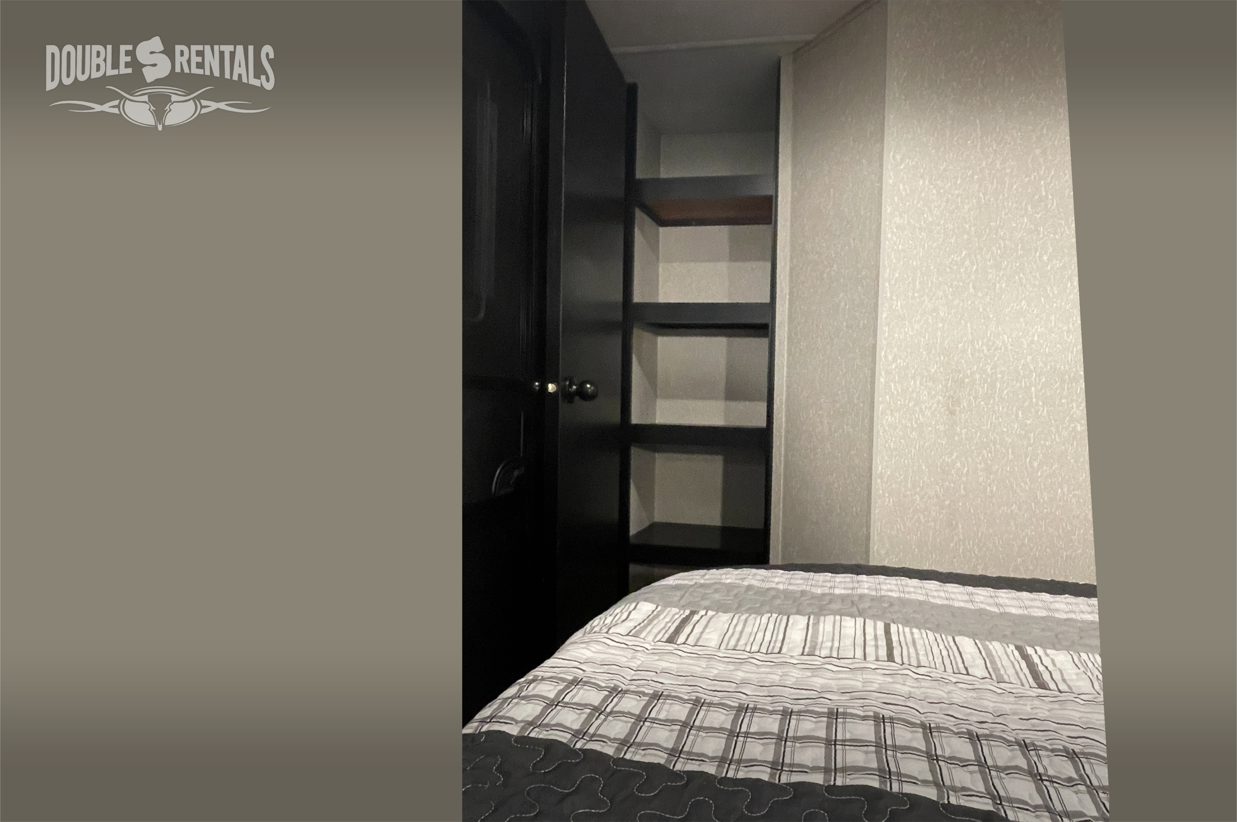 RV rental bedroom showcasing a patterned comforter on the bed & convenient built-in storage shelves.. Forest River Cherokee 2023