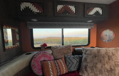 This cozy RV rental offers plush comforts & a wide window view of scenic vineyards. Perfect for a relaxing travel escape.. Forest River Coachmen Prism 2017