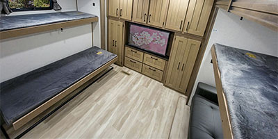 RV rental interior: A spacious bunkhouse with multiple beds, TV, and storage for comfortable living.. KZ Durango 2024