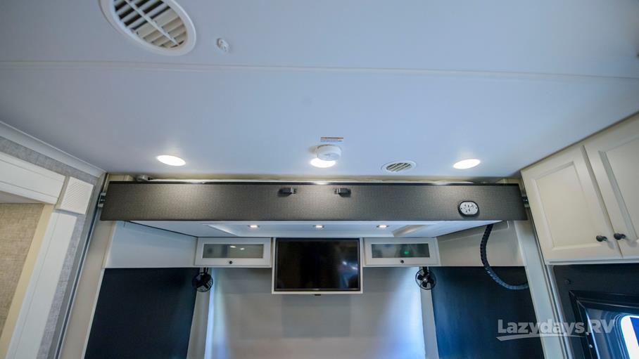 RV rental bedroom area: ceiling with lights, vents, and a clever retractable bed above a TV.. Allegro Allegro Open Road 2025