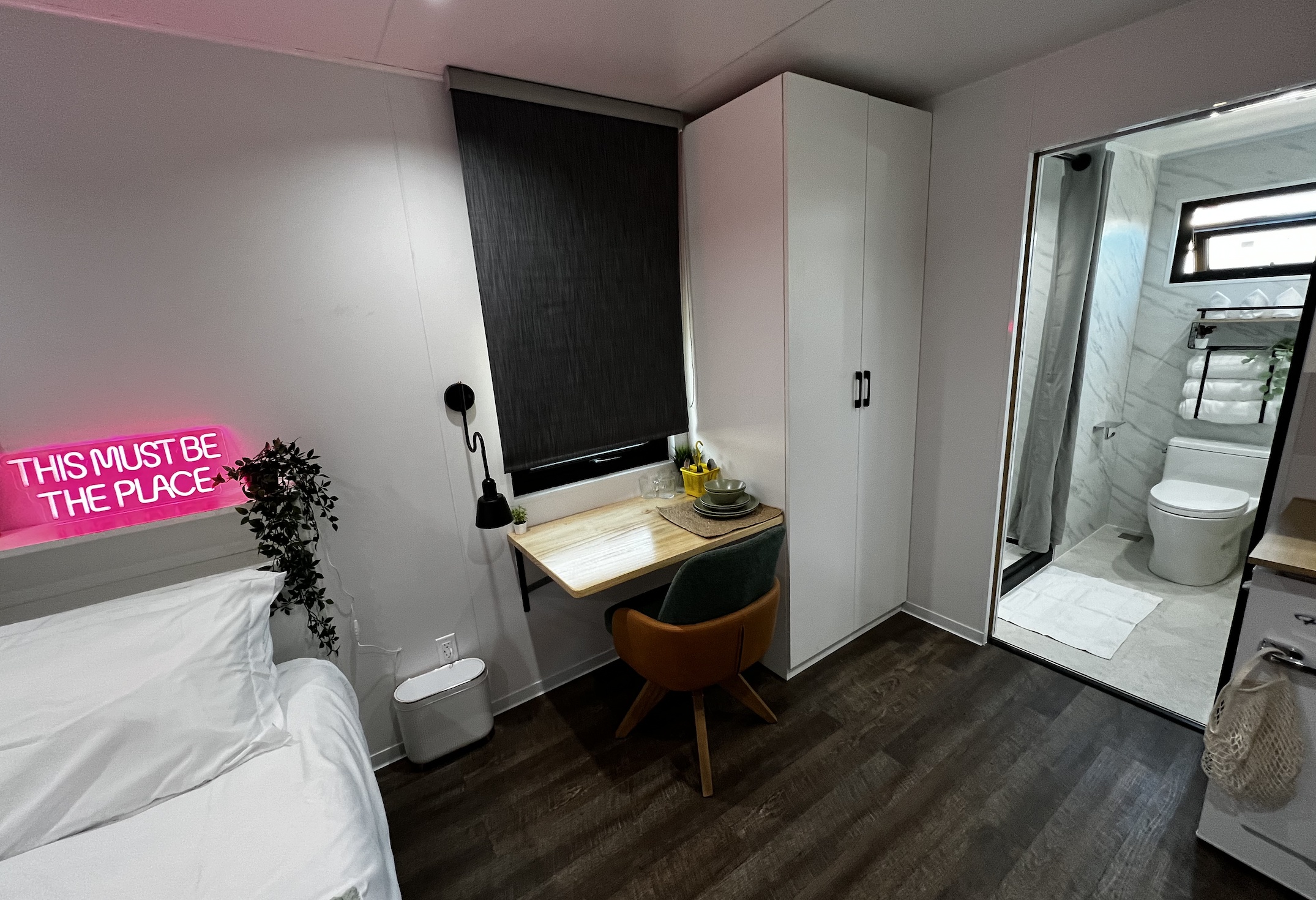 This RV rental offers a chic, compact interior with a bed, desk, and private bath. Ideal for modern travel.. Custom Custom 2024