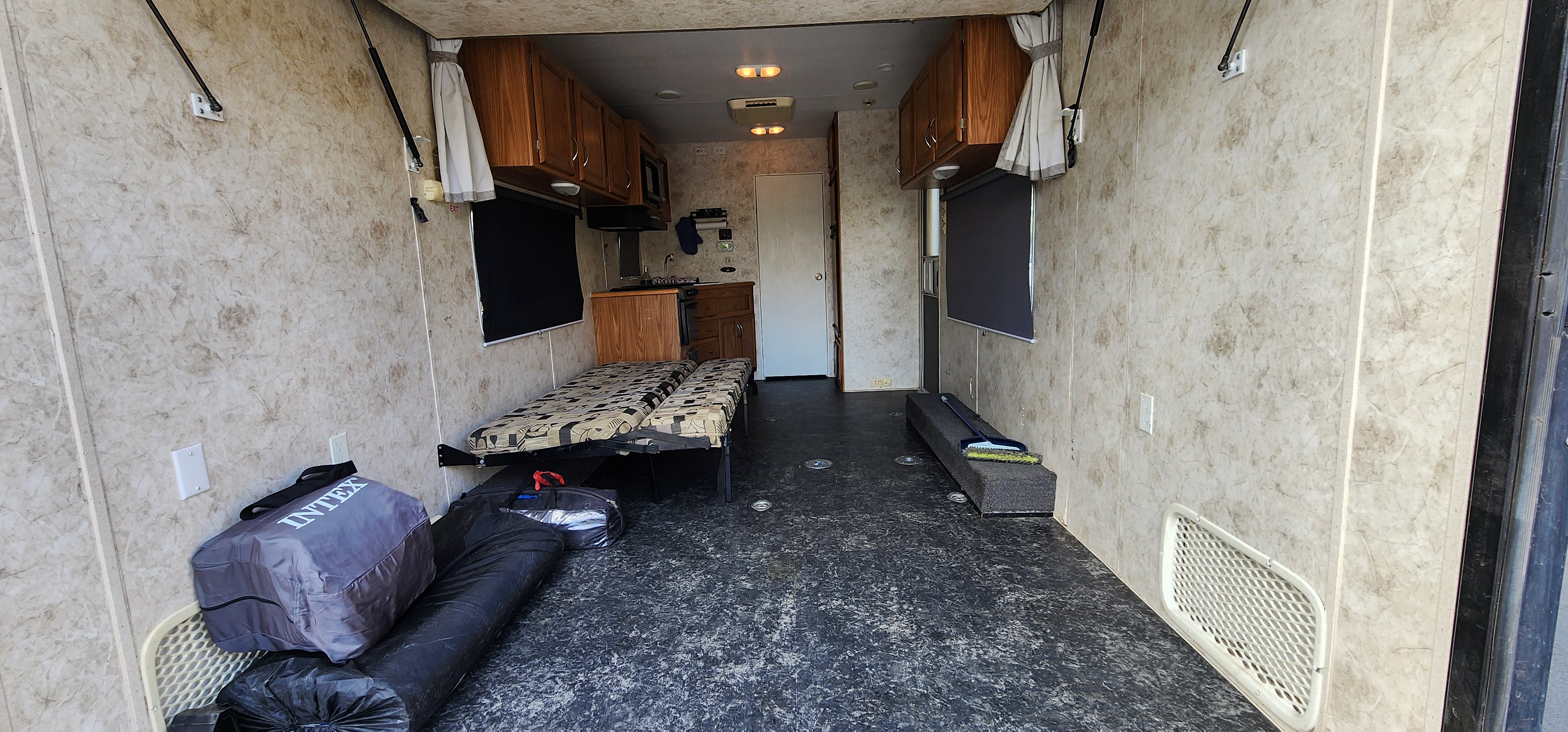 RV rental interior: main living area with two beds, kitchenette, and storage. Perfect for road trips.. Eclipse Recreational Vehicles Attitude 2025