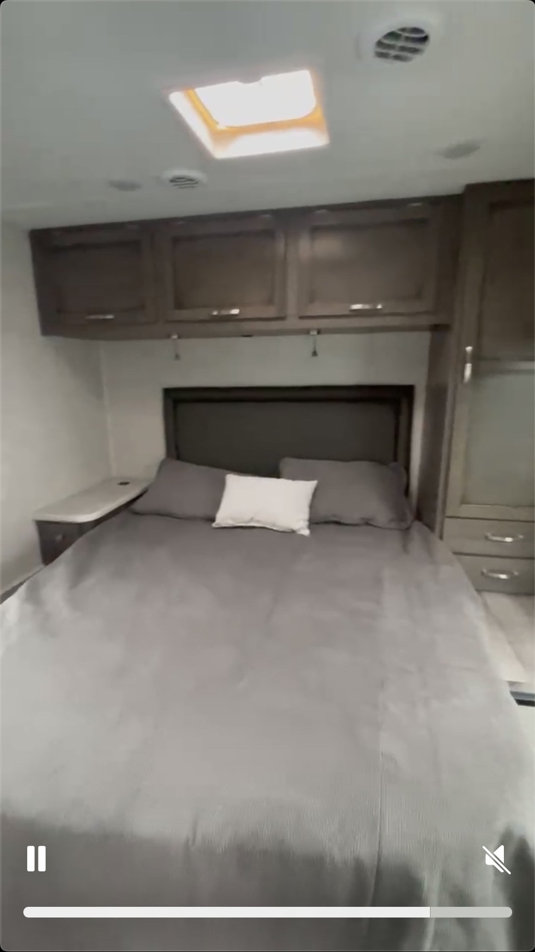 Cozy RV rental bedroom with a comfy bed, overhead storage, and skylight.. Jayco Redhawk 2023