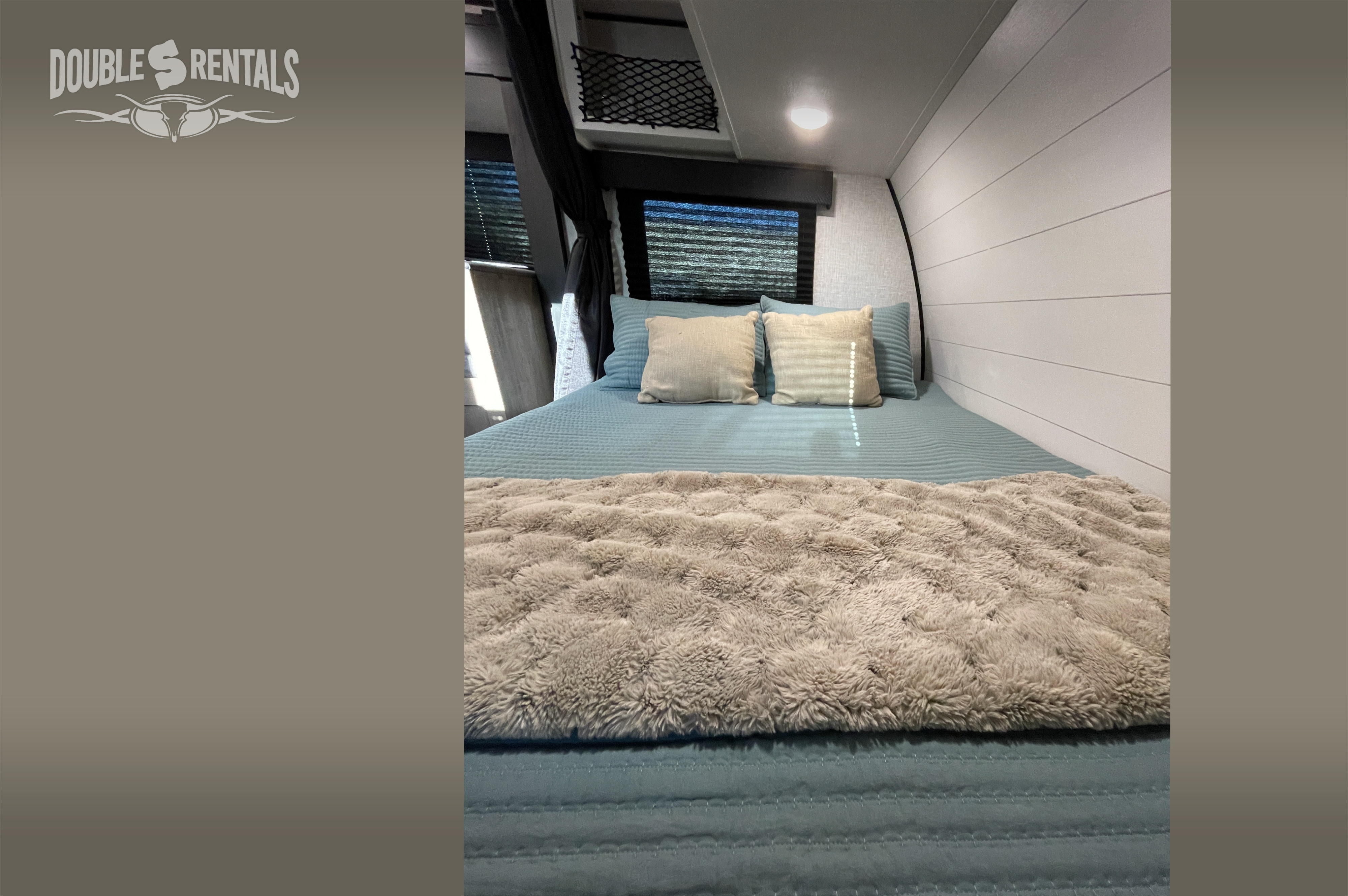 Cozy RV rental bedroom with a comfortable bed, blue comforter, fluffy blanket, and modern shiplap walls.. Jayco Jay Flight 2024