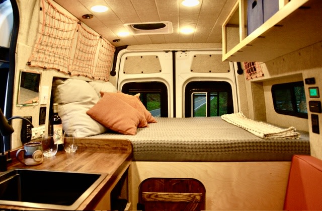 Full-length queen bed with an 8” mattress and built on a permanent platform - we wanted to prioritize and comfortable sleeping space in our vans.
Rental comes with fresh linens, pillows, and an extra blanket. . Mercedes-Benz Sprinter 2019