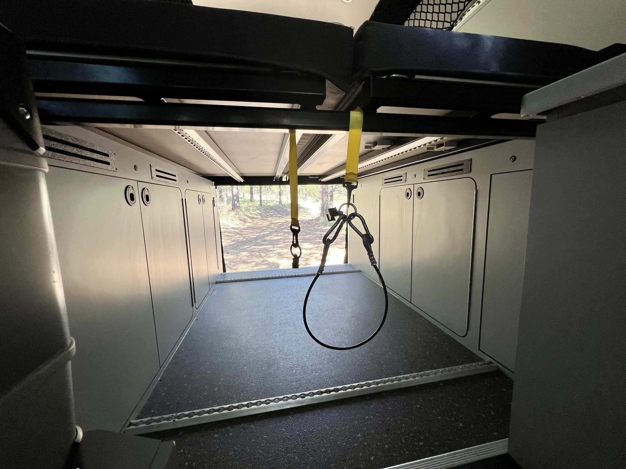 RV rental: Modular interior with overhead bed, ample cargo space, and integrated wall storage.. Mercedes-Benz Sprinter RV Motorhome Campervan 2022