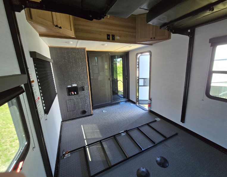 Spacious rv rental toy hauler garage interior with diamond plate floor, ready for adventure and cargo.. Forest River XLR Nitro 2023