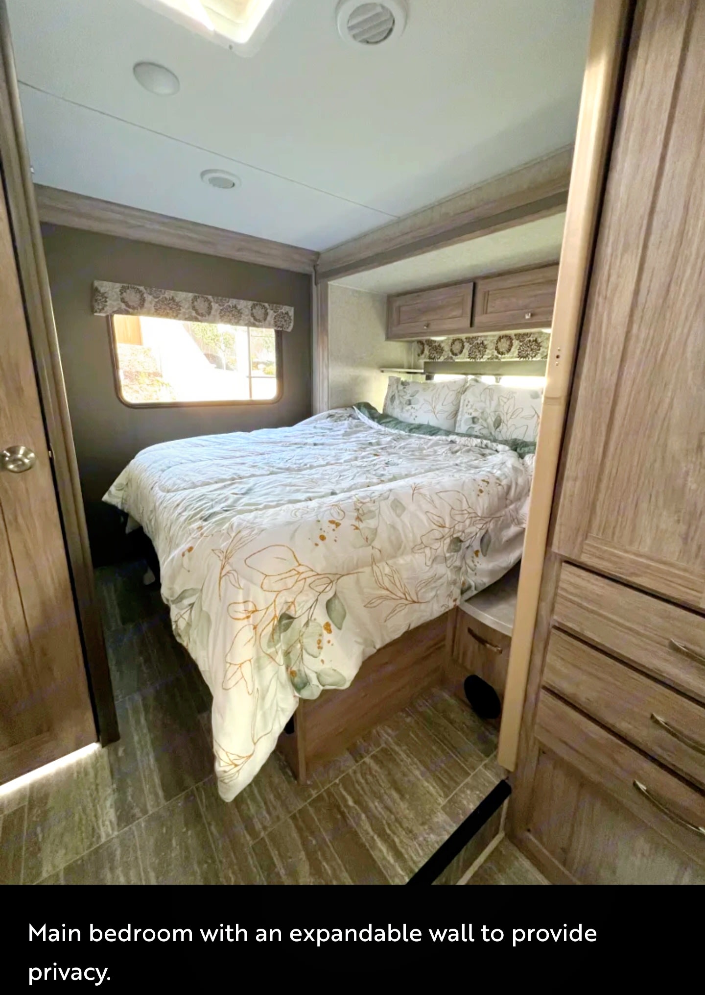 Cozy RV rental bedroom with queen bed and expandable privacy wall.. Forester LE 2021