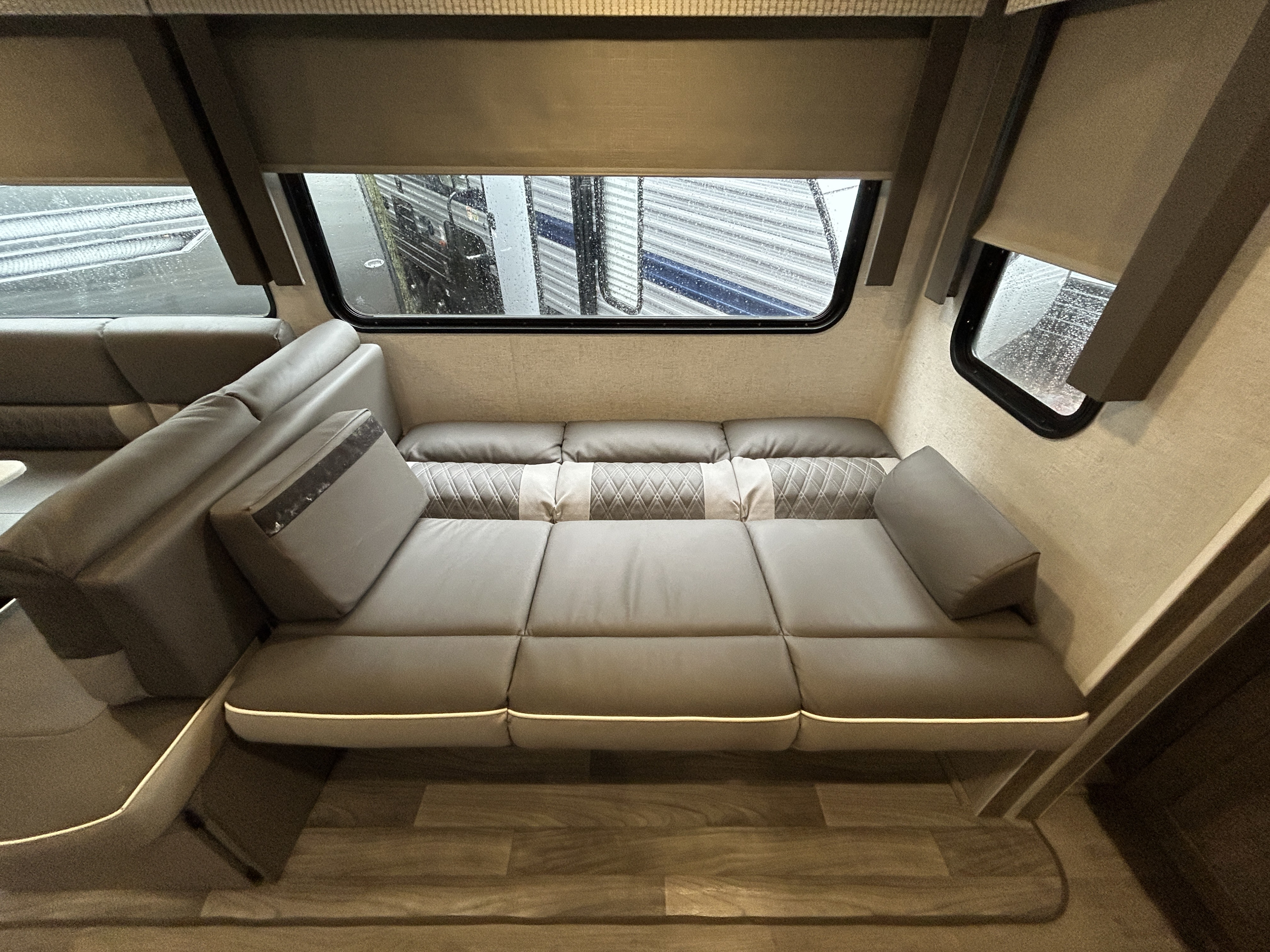 Inside this modern RV rental, find a comfortable, spacious living area with a convertible sofa bed, ideal for travel.. Forest River Salem 2021