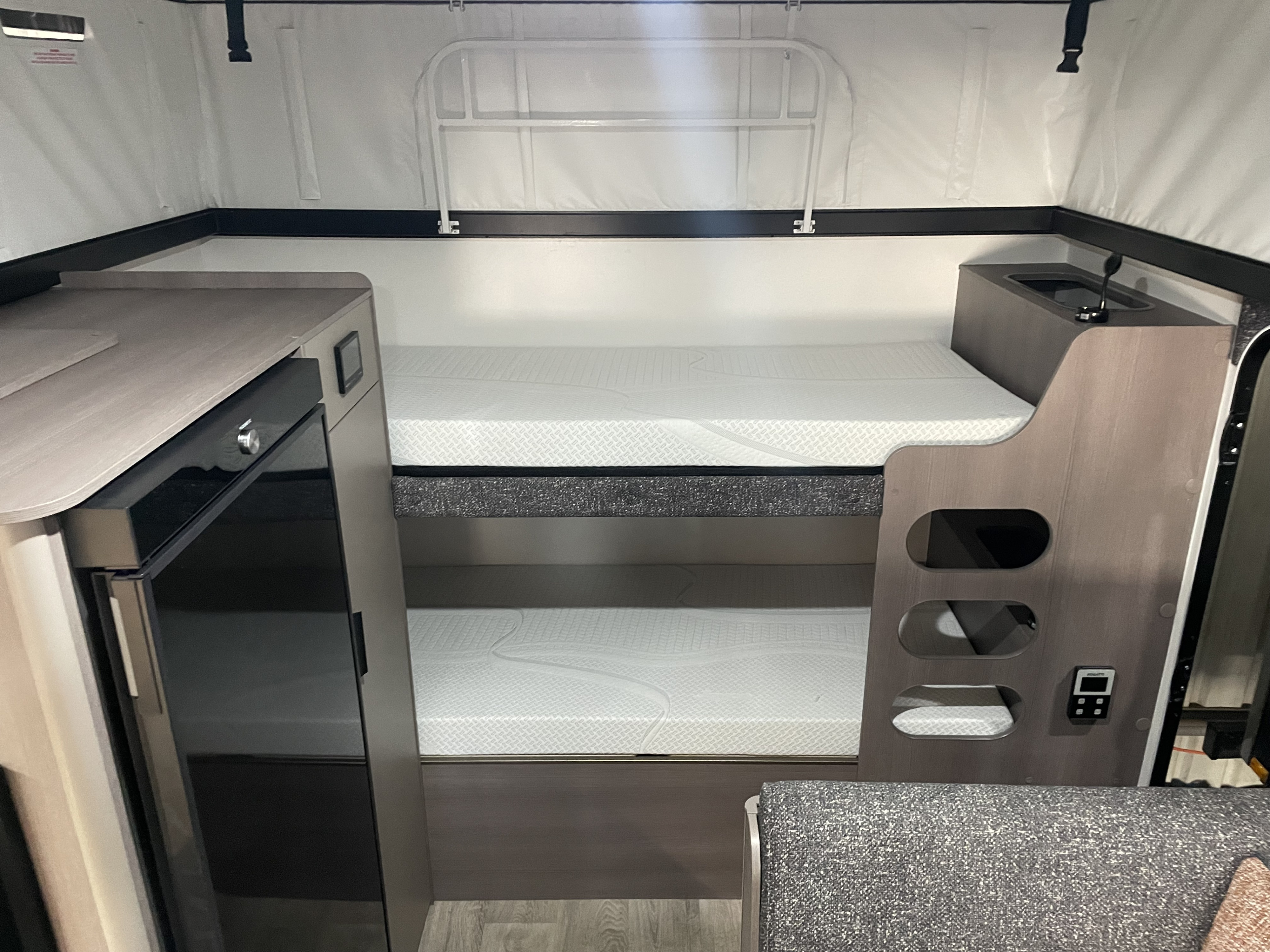 RV rental featuring comfortable bunk beds, a practical sink, and a built-in refrigerator.. Jayco Journey 15.48-6 2024