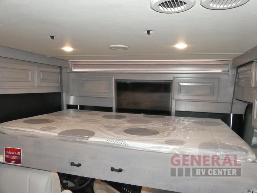 RV rental: Cab-over bunk with convertible mattress, overhead lights, and cabinets for more sleeping.. Holiday Rambler Armada 2024