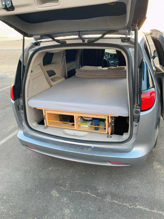 This DIY minivan camper conversion features a comfy bed platform over storage, perfect for an rv rental alternative!. Chrysler Voyager 2022