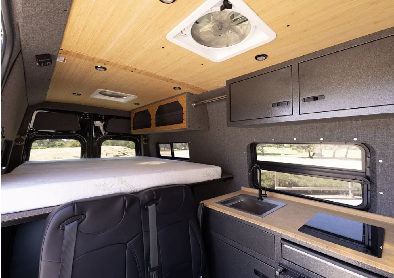 Spacious RV rental interior featuring a comfy bed, functional kitchen, and ample storage for your adventurous travels.. Vanworks Switchback 4D 144 2022